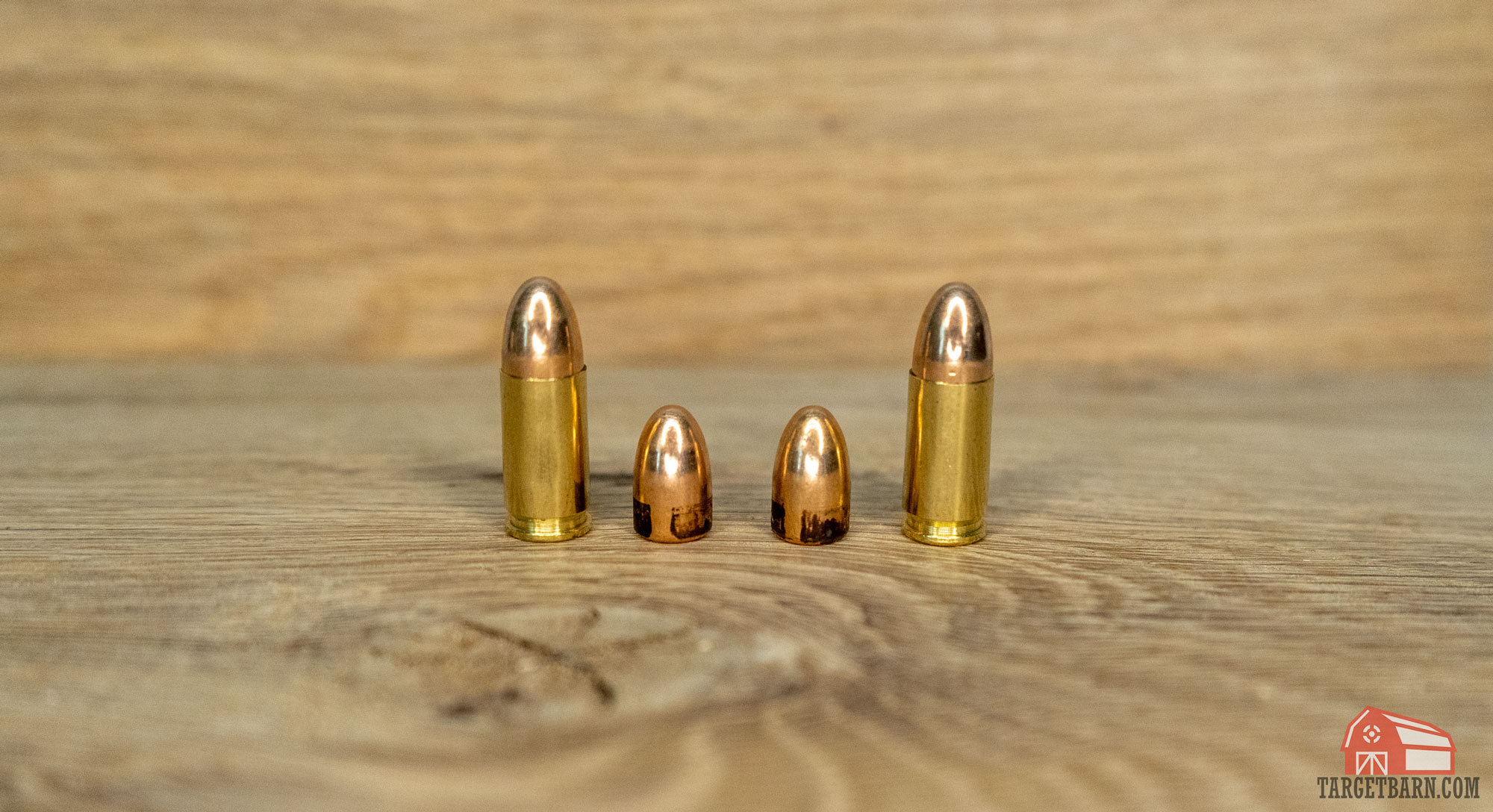 a 9mm 115 grain round and bullet on the left and a 9mm 124 grain bullet and round on the right