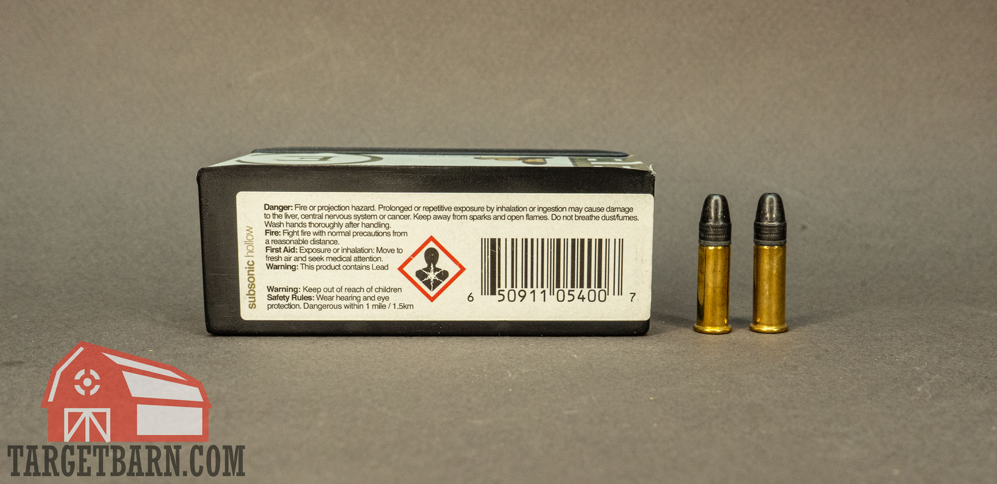 a box of eley 22lr ammo and two rounds showing the warning label on the box