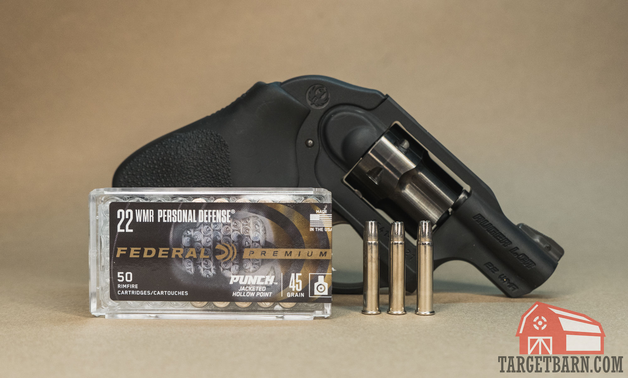 a ruger lcr behind a box and three rounds of federal punch 22 wmr ammo