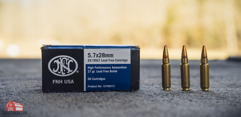 a box and three rounds of FNH 5.7x28mm ammo