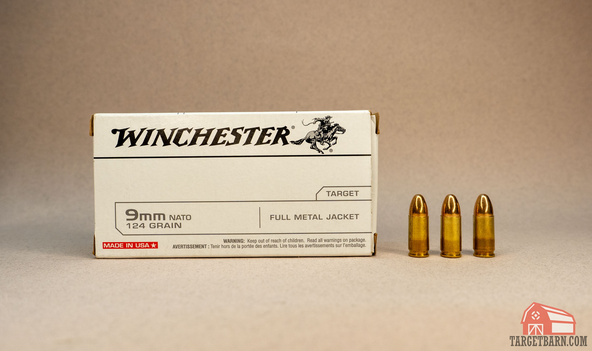 a box of winchester 9mm nato fmj ammo and three rounds