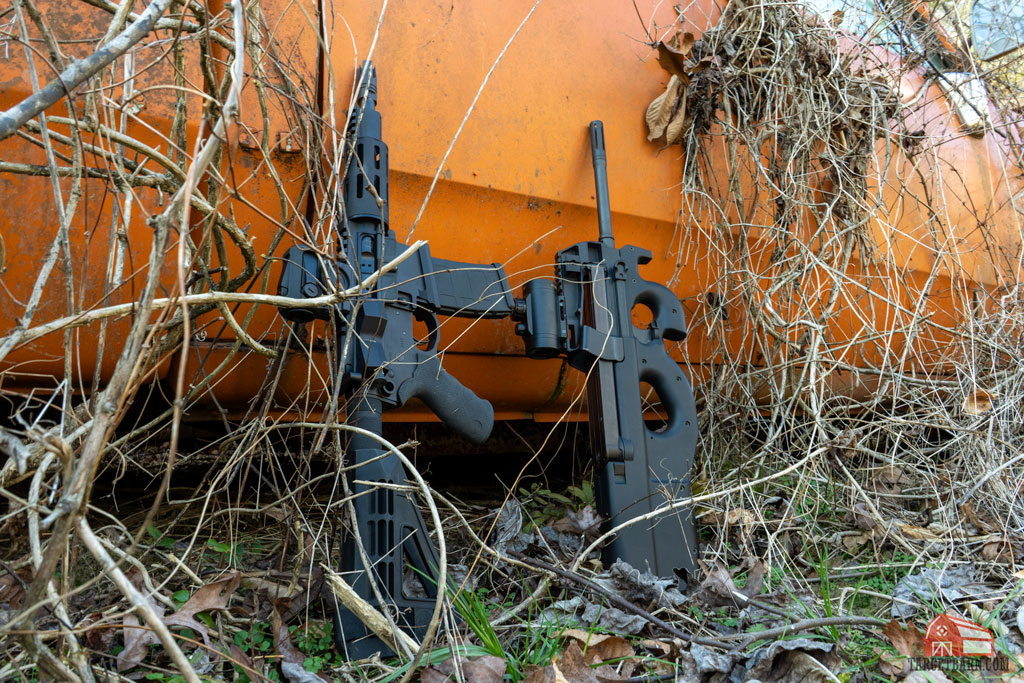 franklin armory salus pdw and fn ps90 leaning against an orange truck