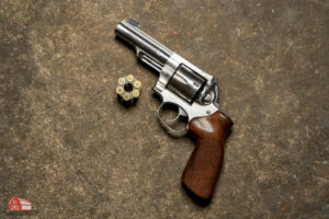 a ruger lcr revolver with an internal hammer and a smith & wesson 38 revolver with a shrouded hammer