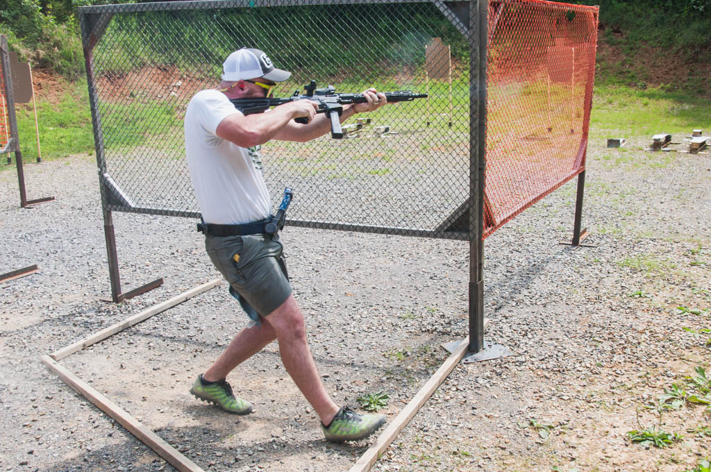 a PCC shooter shooting a USPSA stage