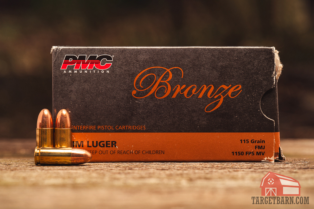 PMC Bronze 9mm ammo displayed PMC Bronze 9mm ammo on display at a shooting range