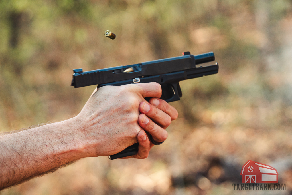 Shooting 9mm ammo at the range The author shooting 9mm ammo at the range