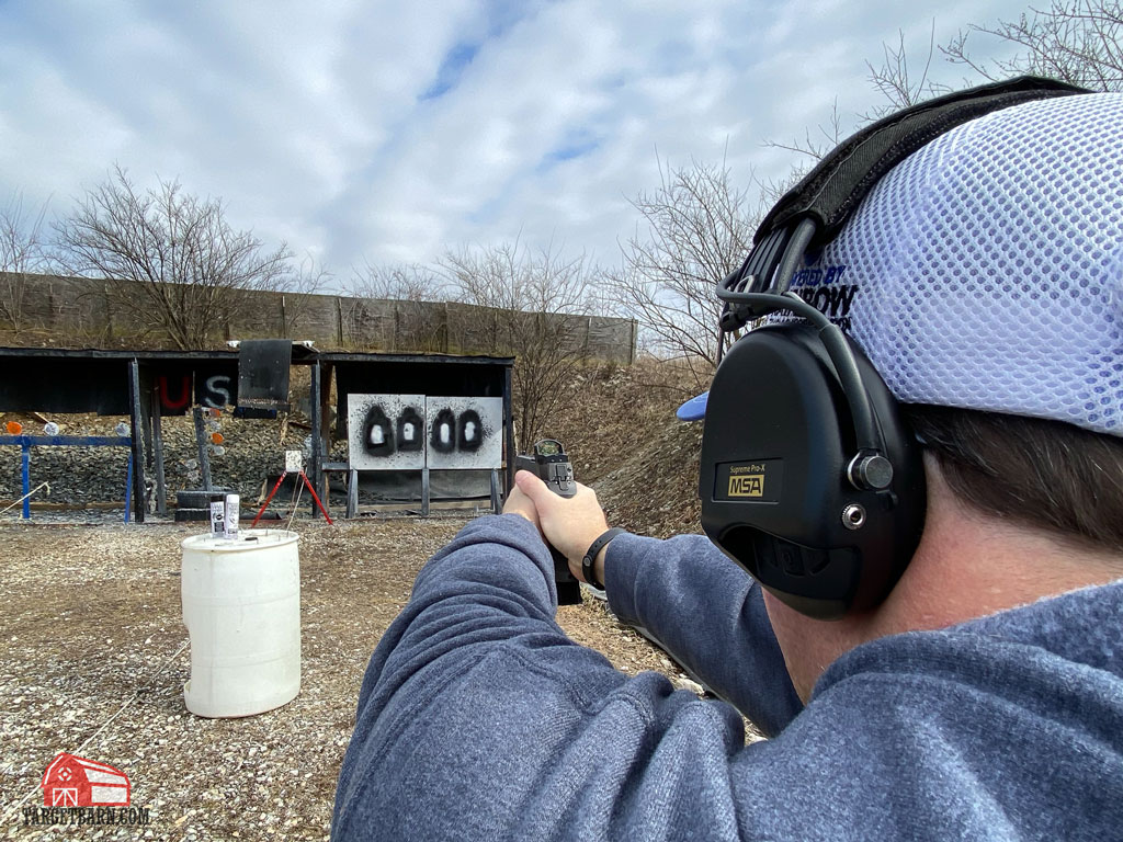 the author demonstrating how to sight in a red dot using the unsupported method