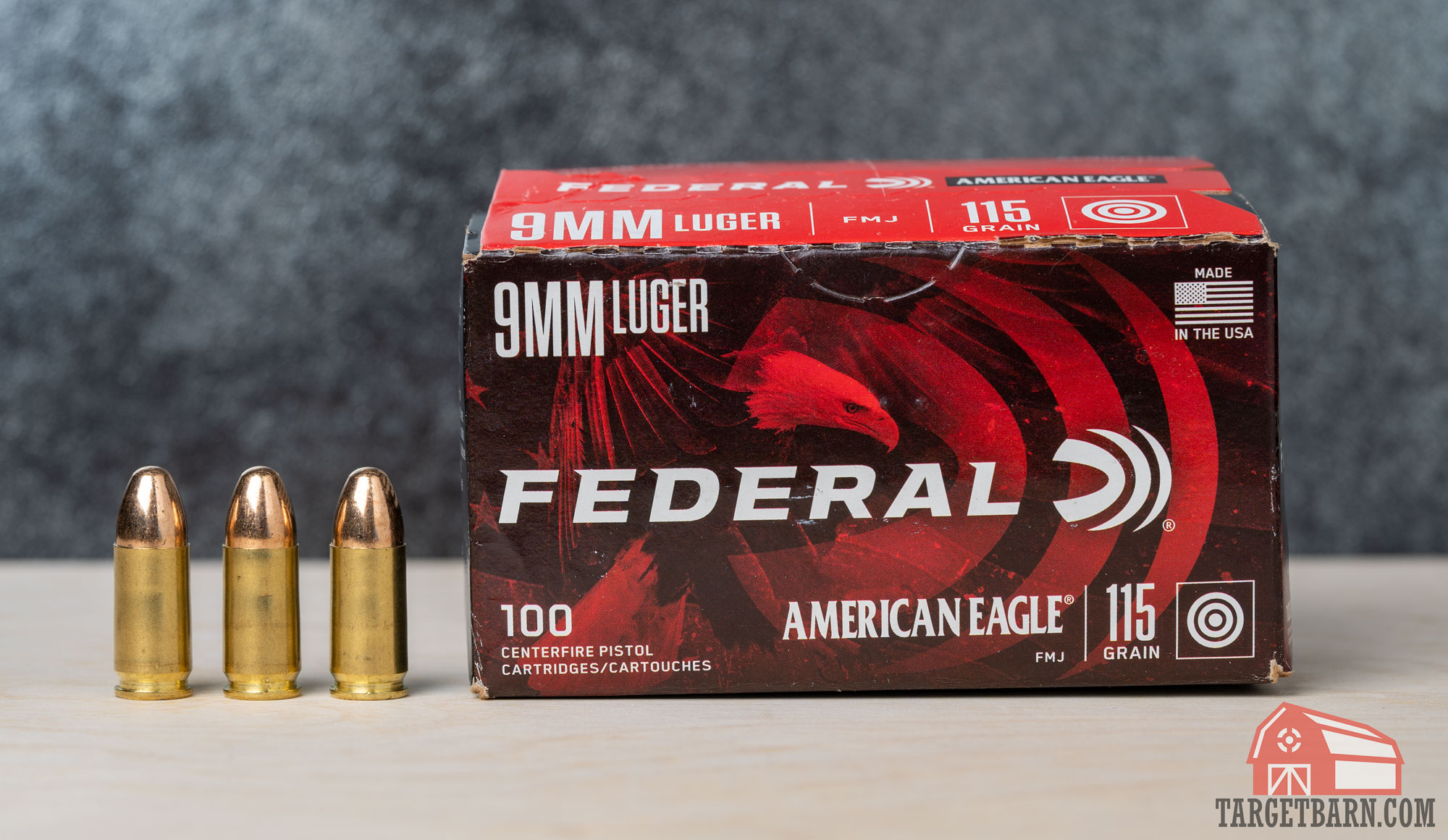 a box and three rounds of federal american eagle 115gr. fmj