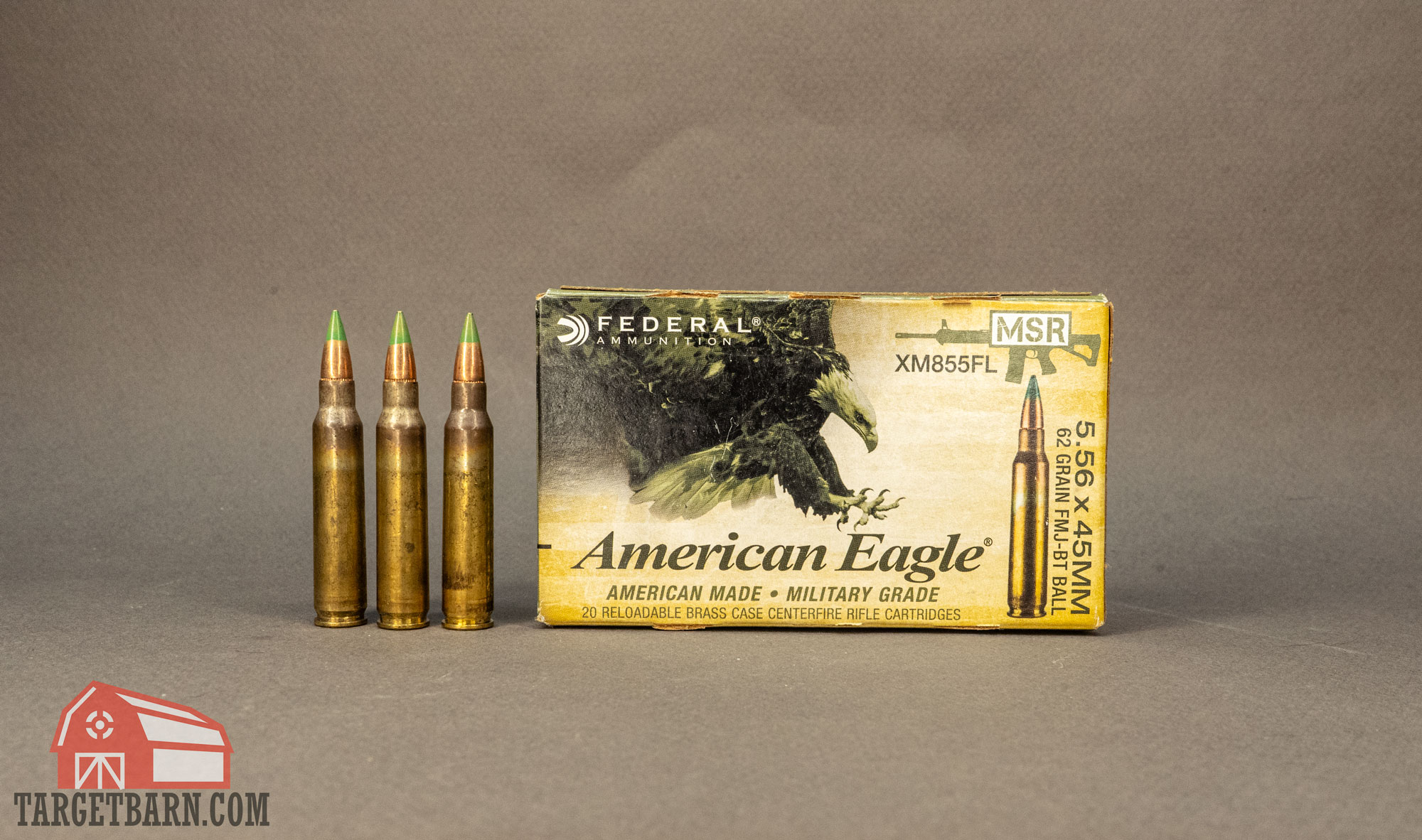 three rounds and a box of american eagle green tip m855 ammo