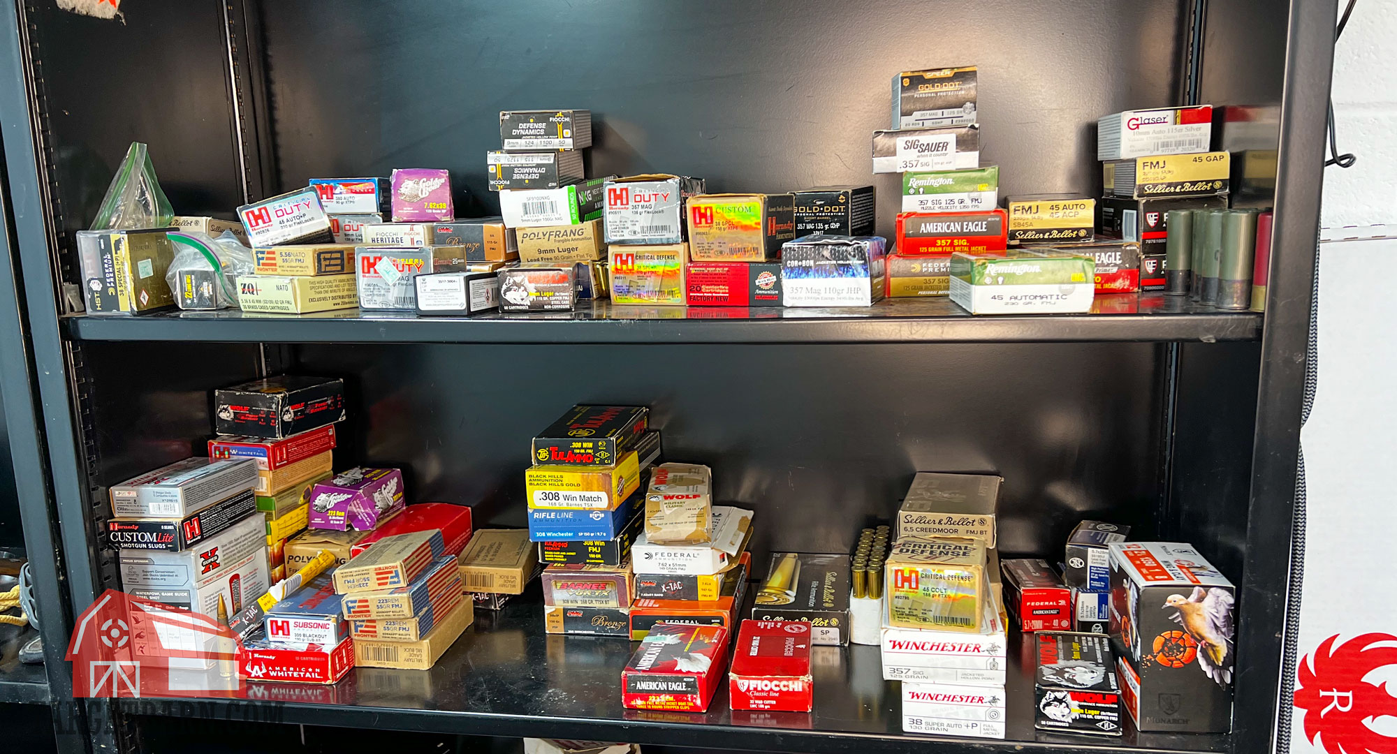 two disorganized shelves filled with ammo boxes