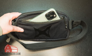 the vertx everyday fanny pack rear pocket with an iphone inside