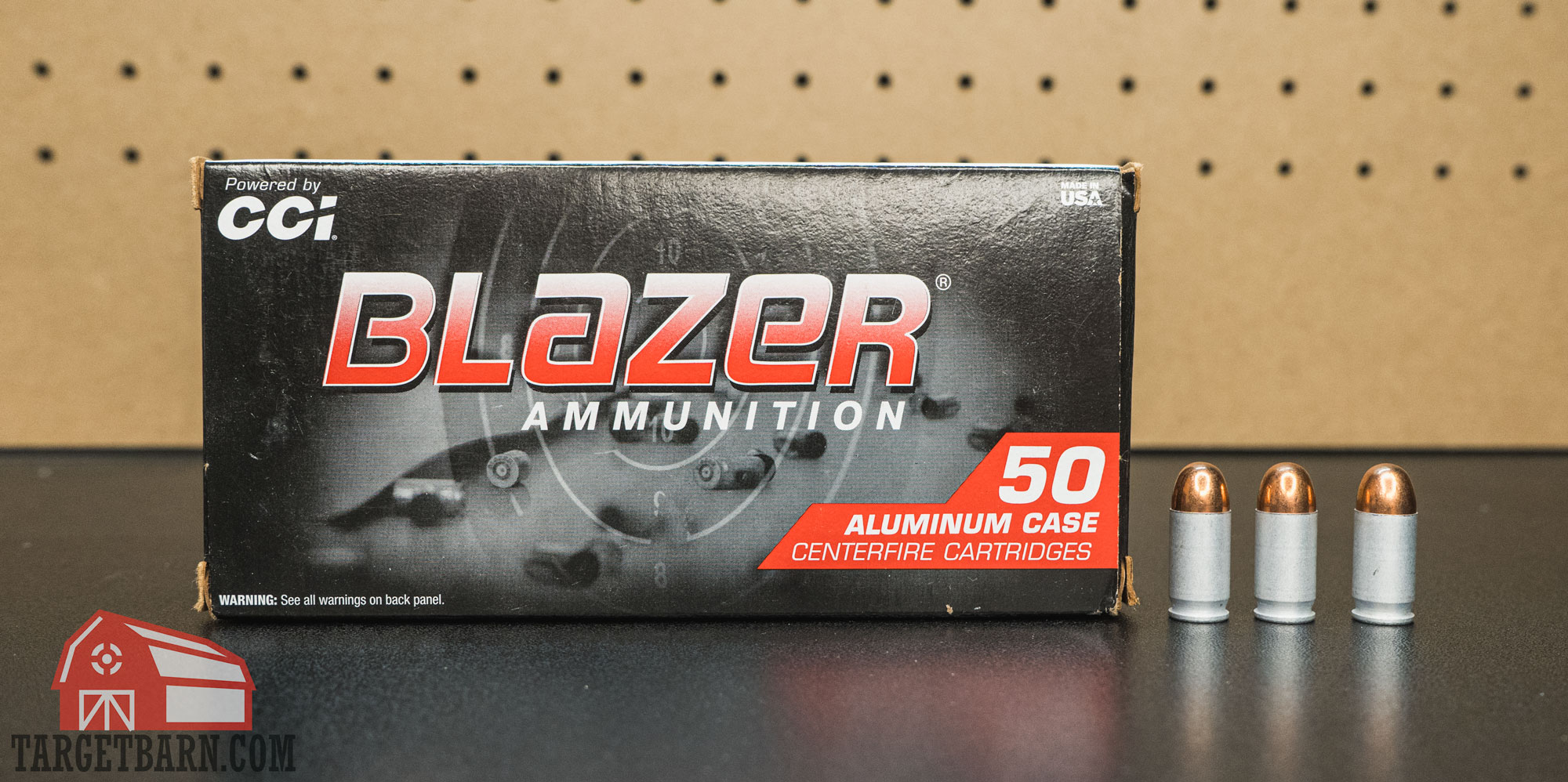 a box and three rounds of blazer aluminum 380 ammo