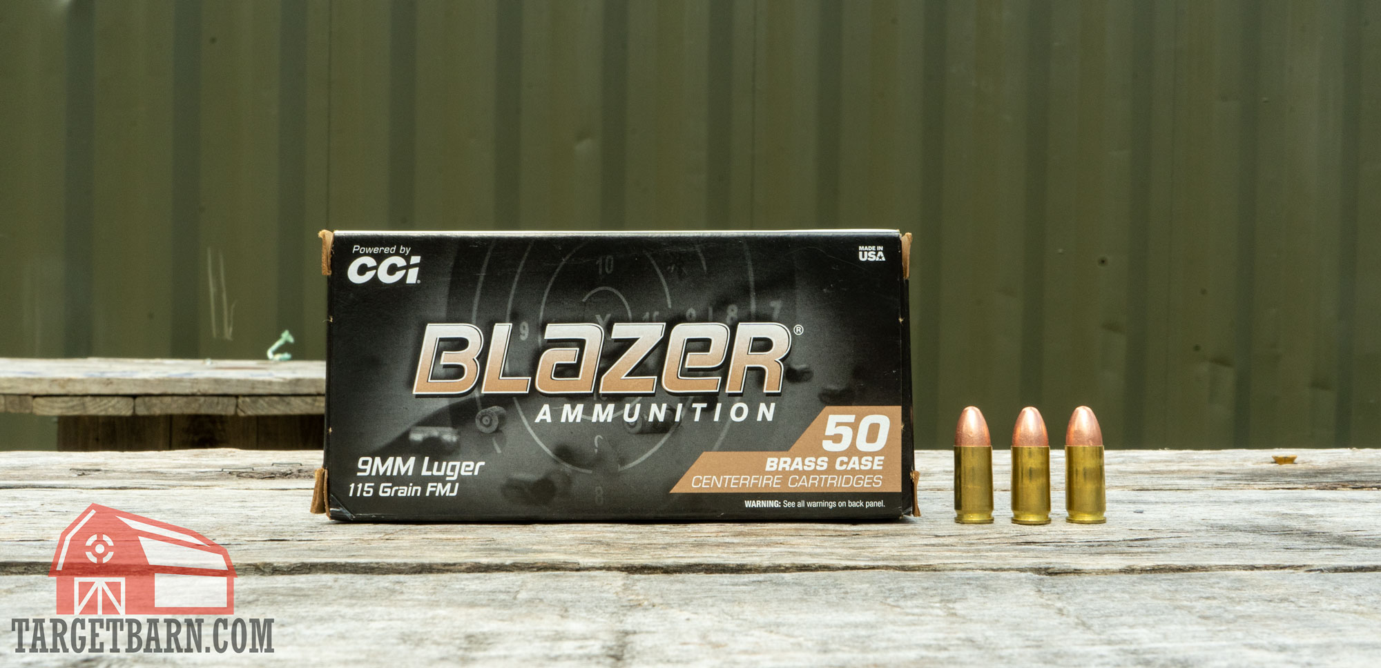 a box and three rounds of cci blazer brass 9mm 115gr ammo