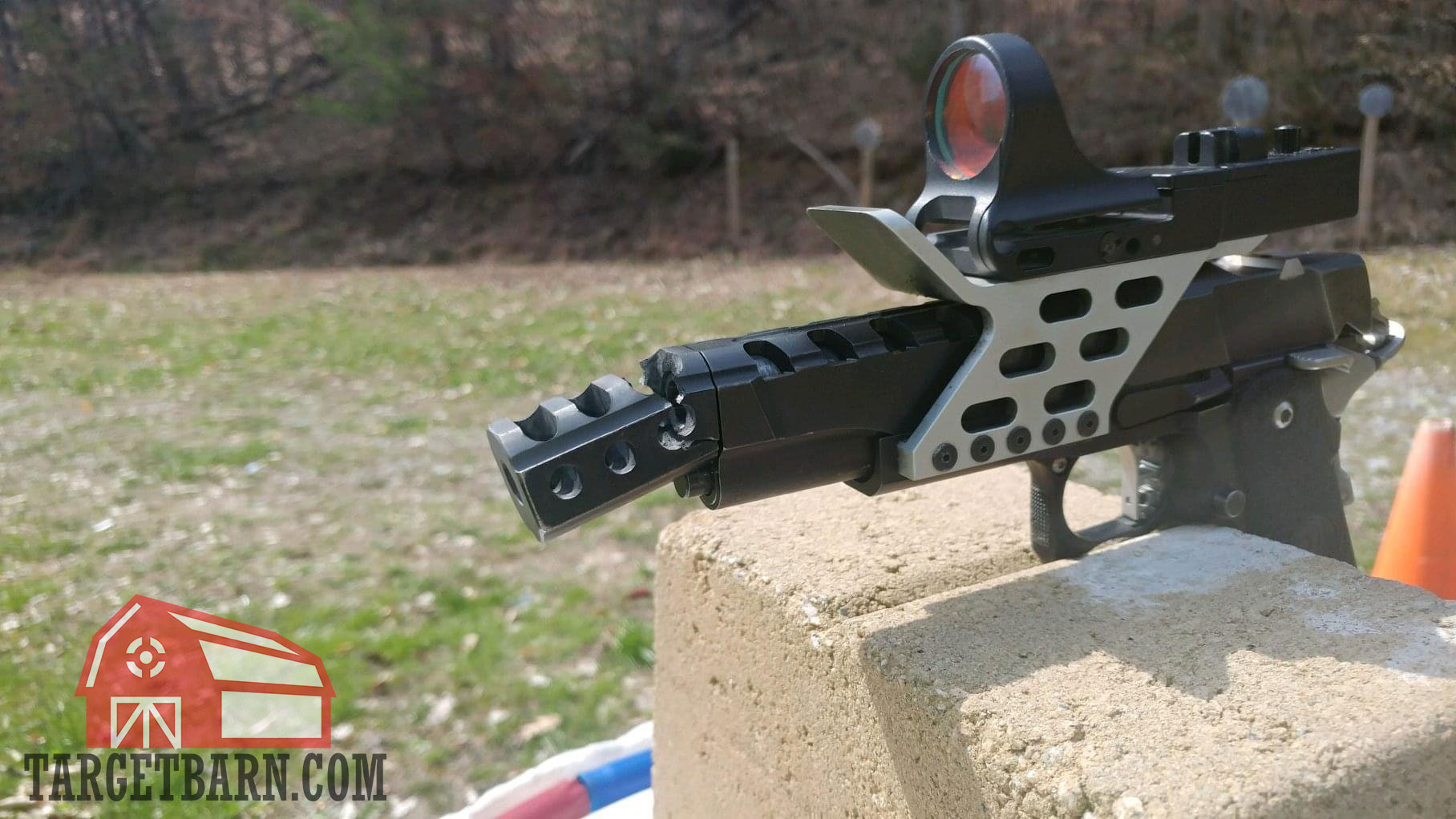 a competition pistol with a broken pistol compensator