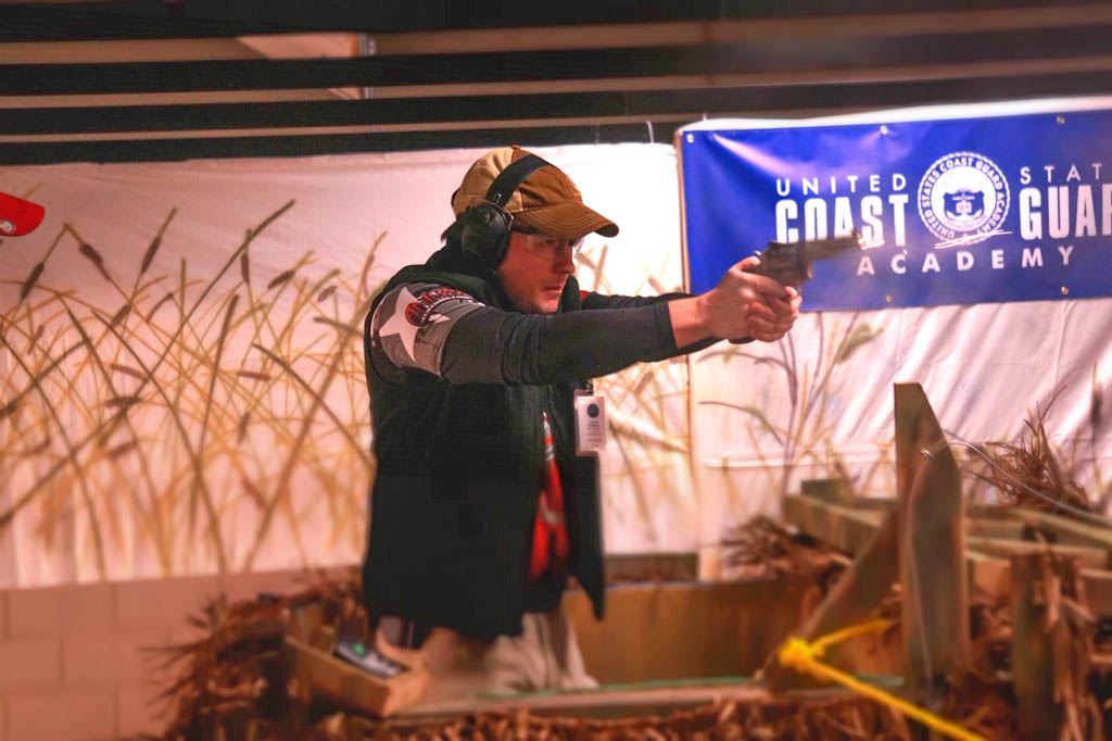 the author shooting a revolver hoping to score well in an IDPA match