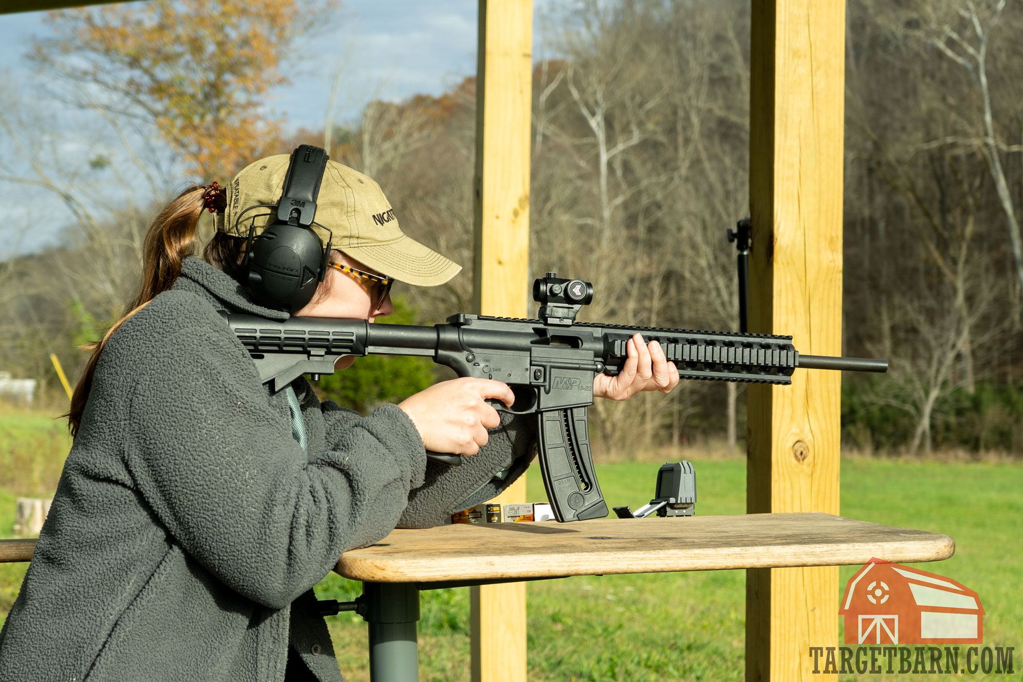 the author shooting a rifle at a benchrest to chronography 22lr ammo