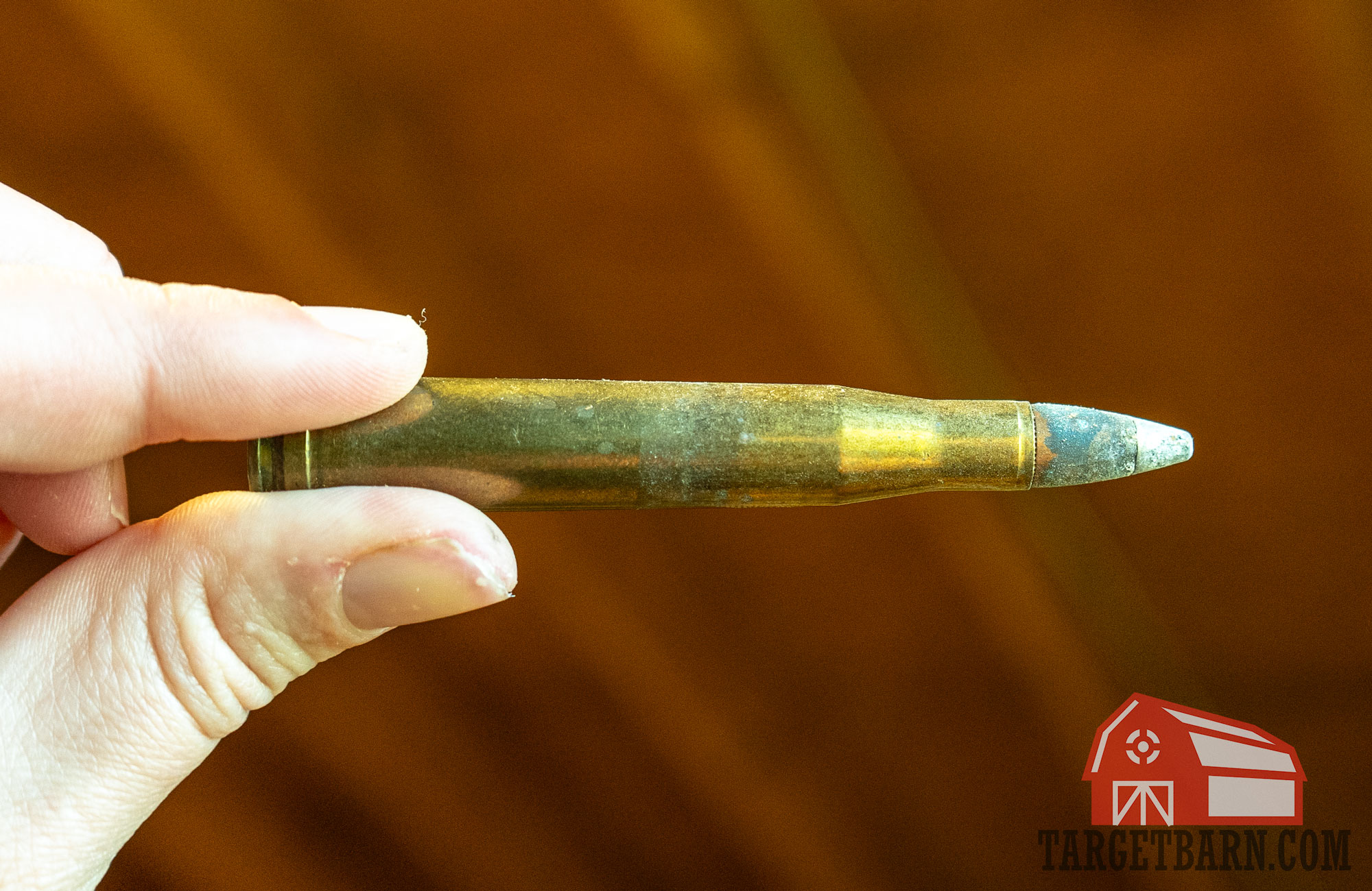 an old rifle round showing corrosion on the bullet