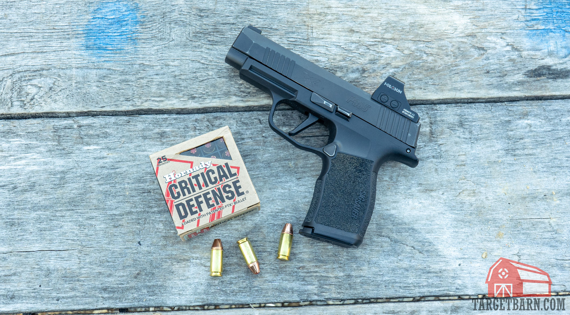 a sig p365xl with a box and three rounds of hornady critical defense 9mm