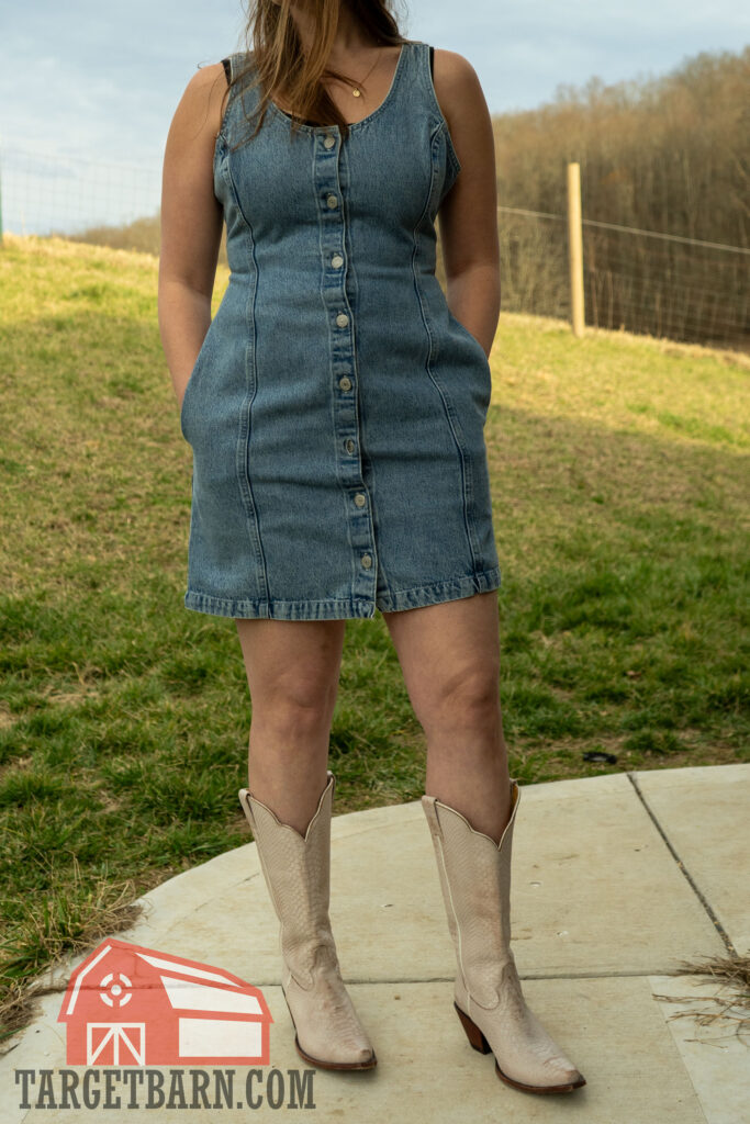 the author wearing a denim dress while concealing with the enigma