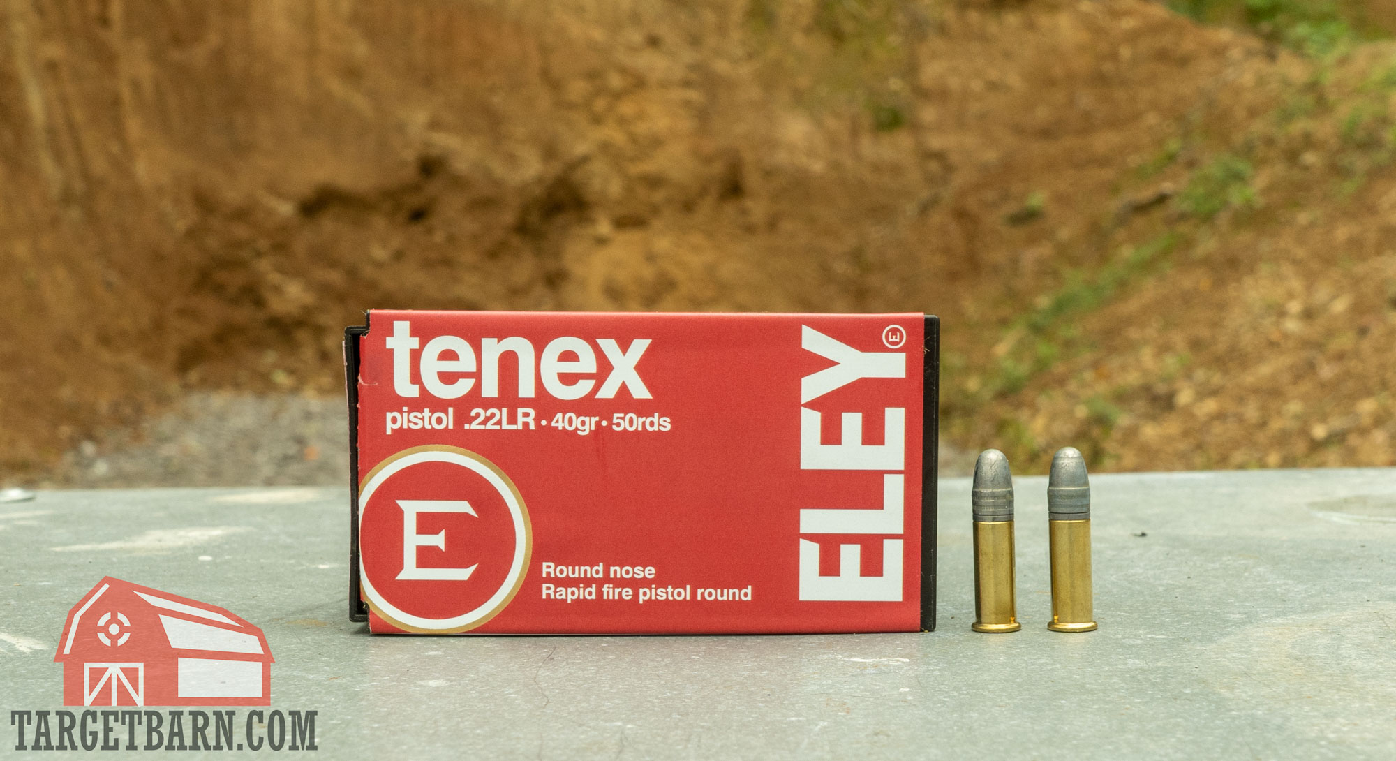 a box and two rounds of eley tenex pistol .22lr ammo at the range