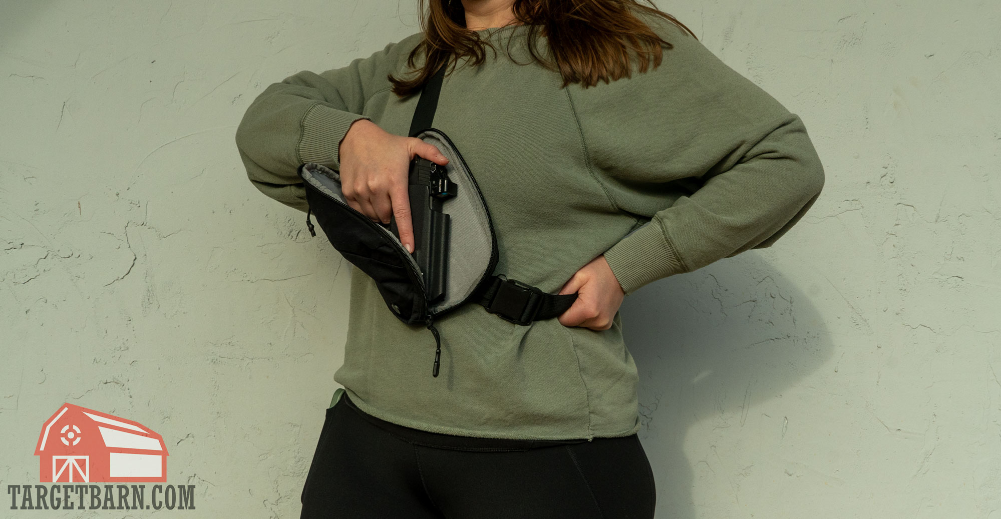 holding the fanny pack stable to draw the gun