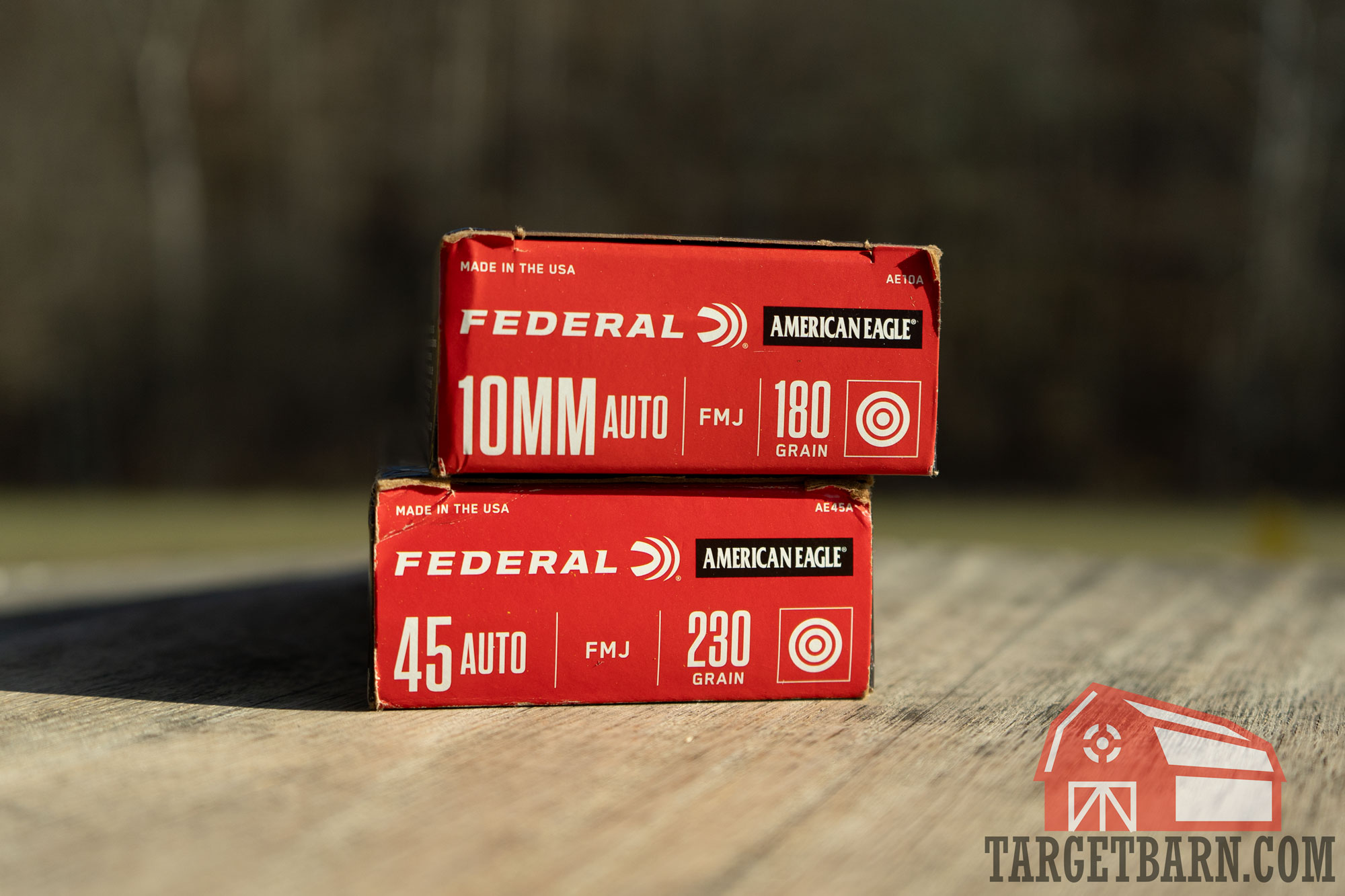 a box of federal american eagle 10m on top of a box of federal american eagle .45 acp at the range