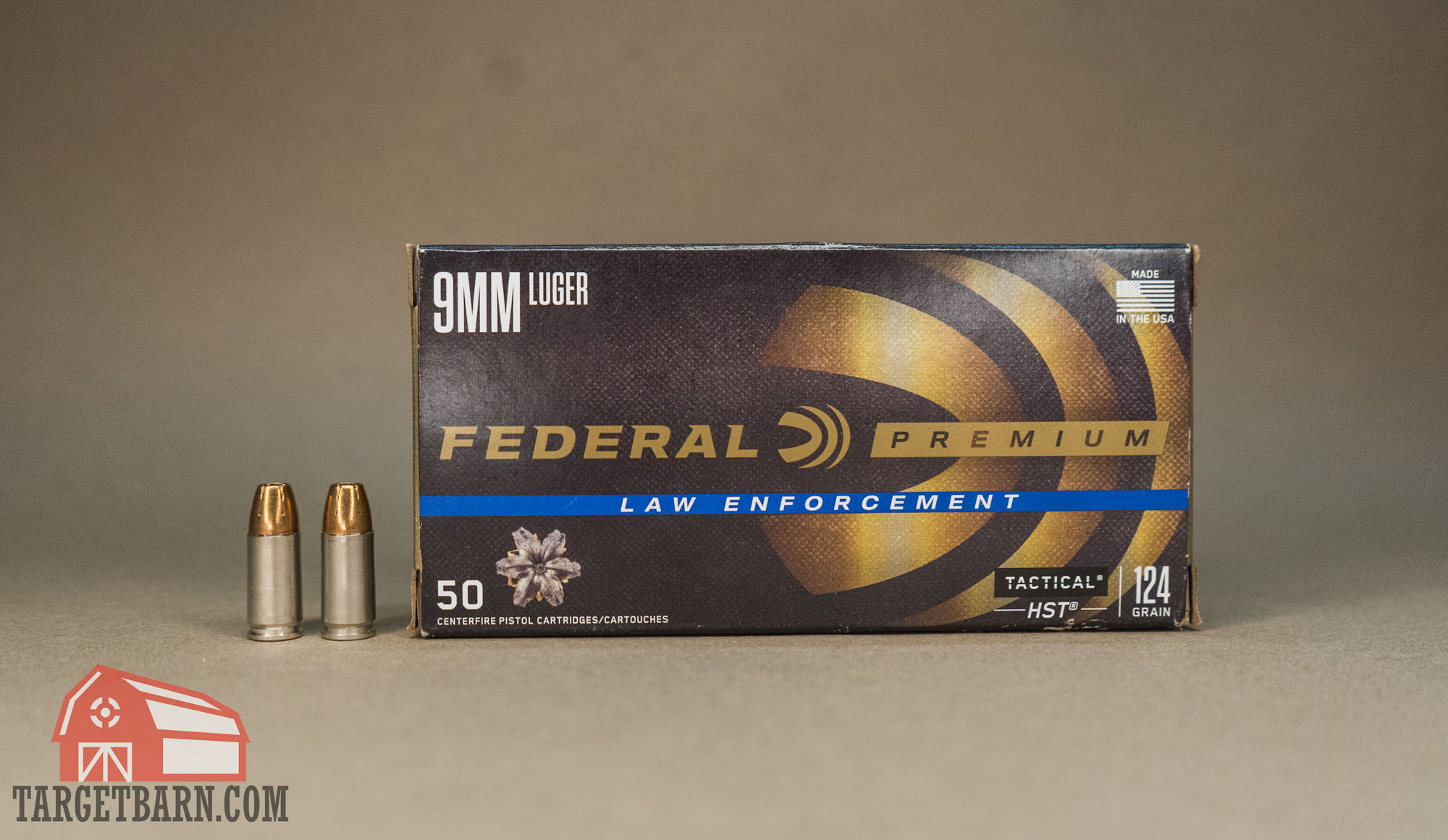 a box and two rounds of federal premium 9mm 124gr. hst