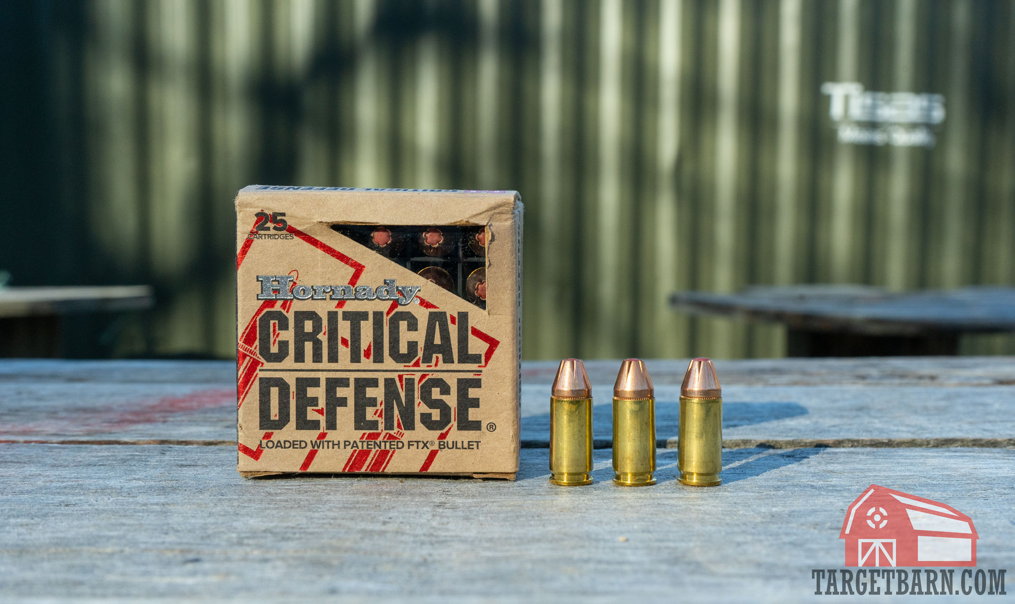 a box and three rounds of hornady critical defense 9mm on a wood table