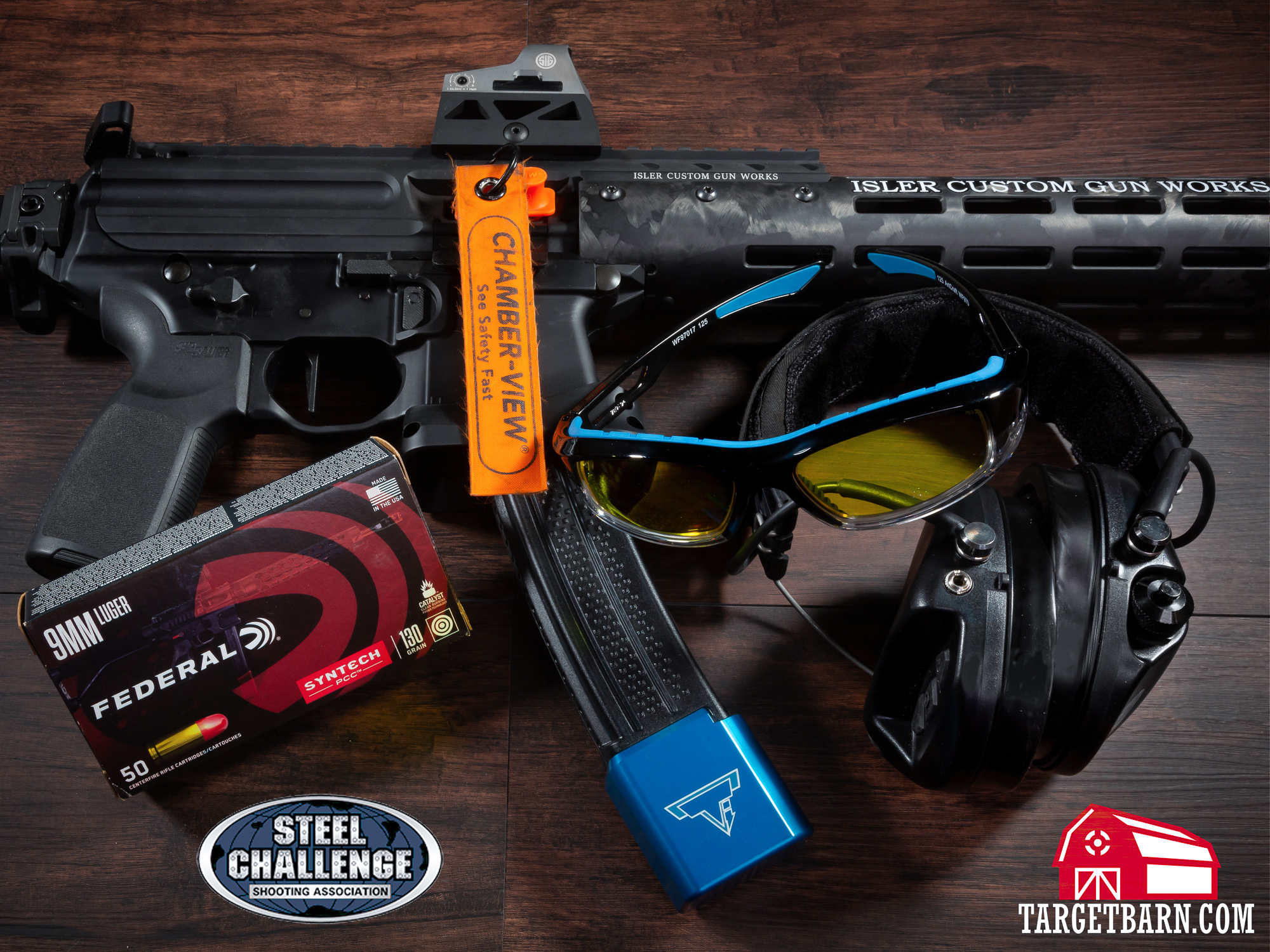 a pcc, eye protection, ear protection, chamber flag, and federal ammo