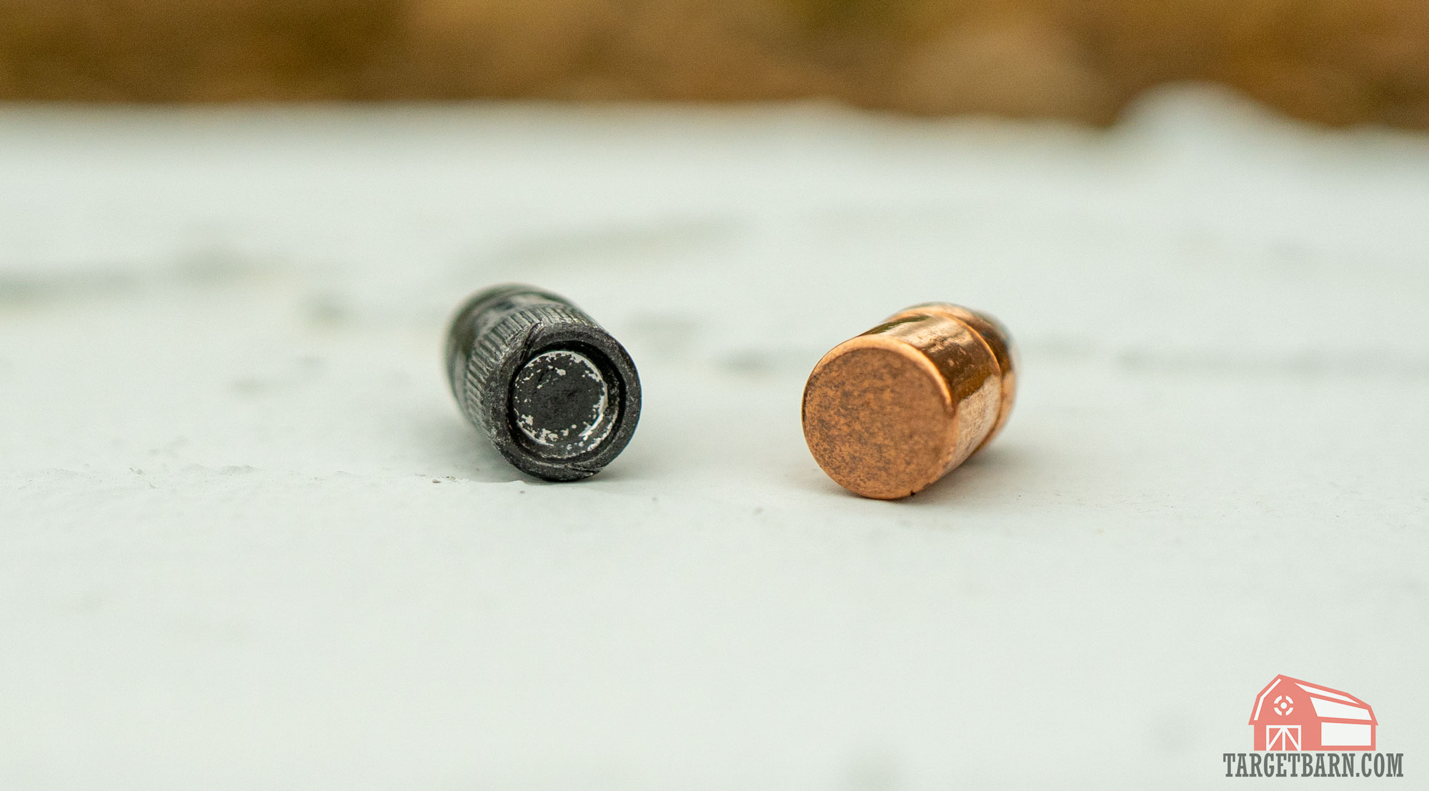 an lrn bullet next to an fmj bullet