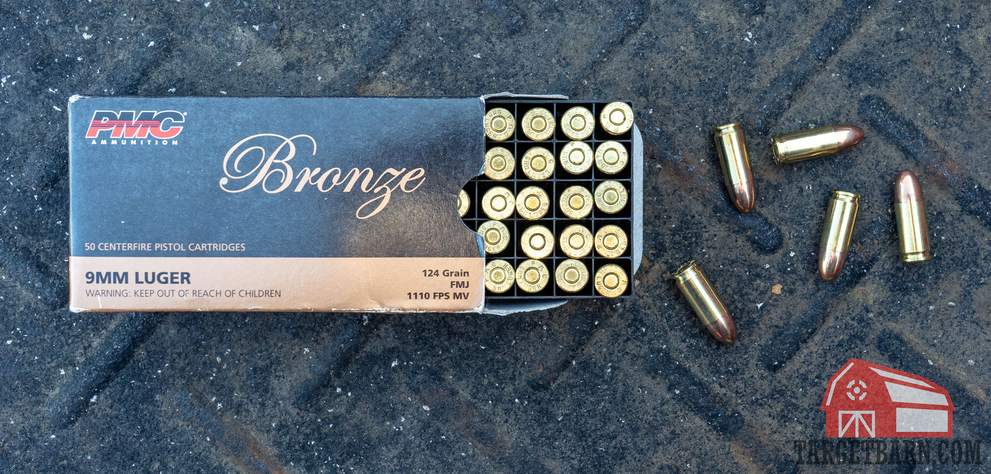 a box and 5 loose rounds of pmc bronze 124gr. fmj