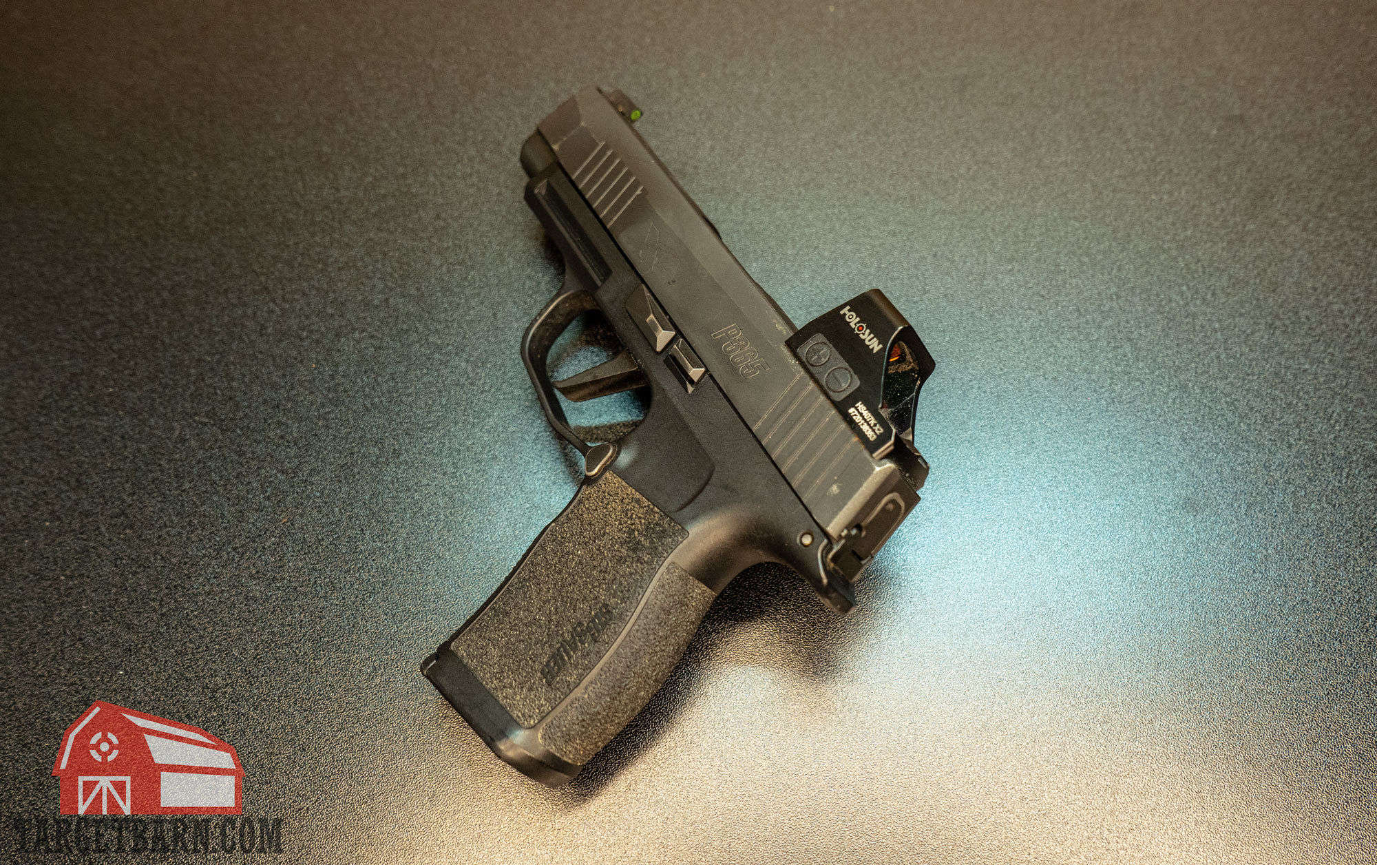 a holosun red dot optic on a sig p365xl pistol
