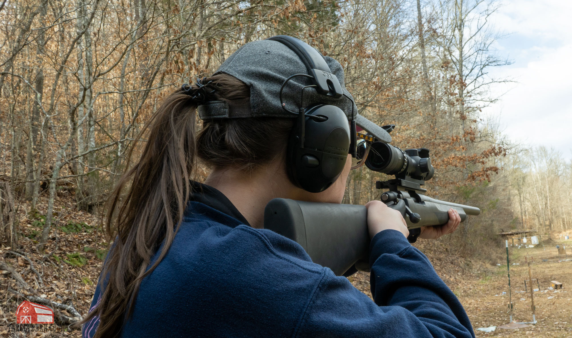 mckenzie shooting a scoped rifle at the range