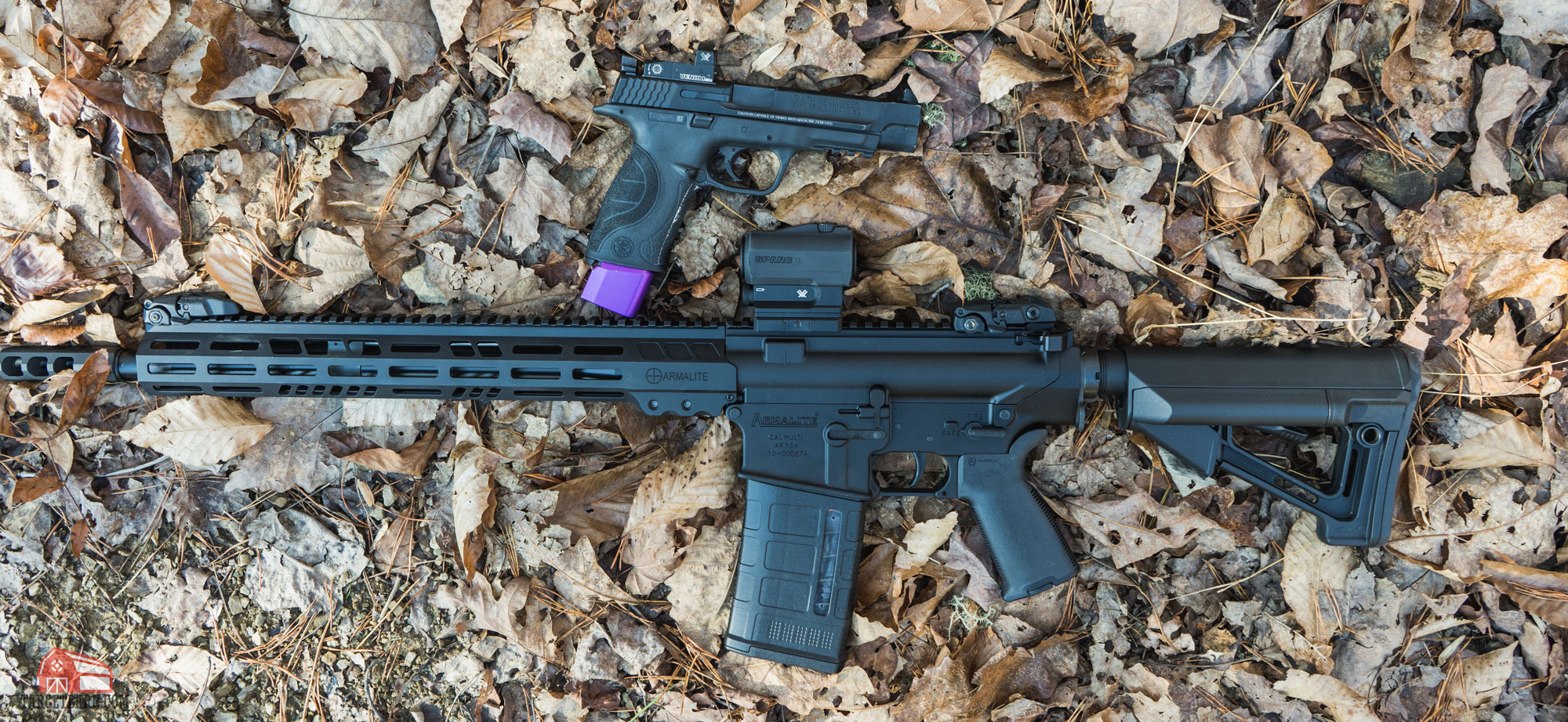 a pistol with a red dot mounted next to an ar-15 with a tubular red dot mounted