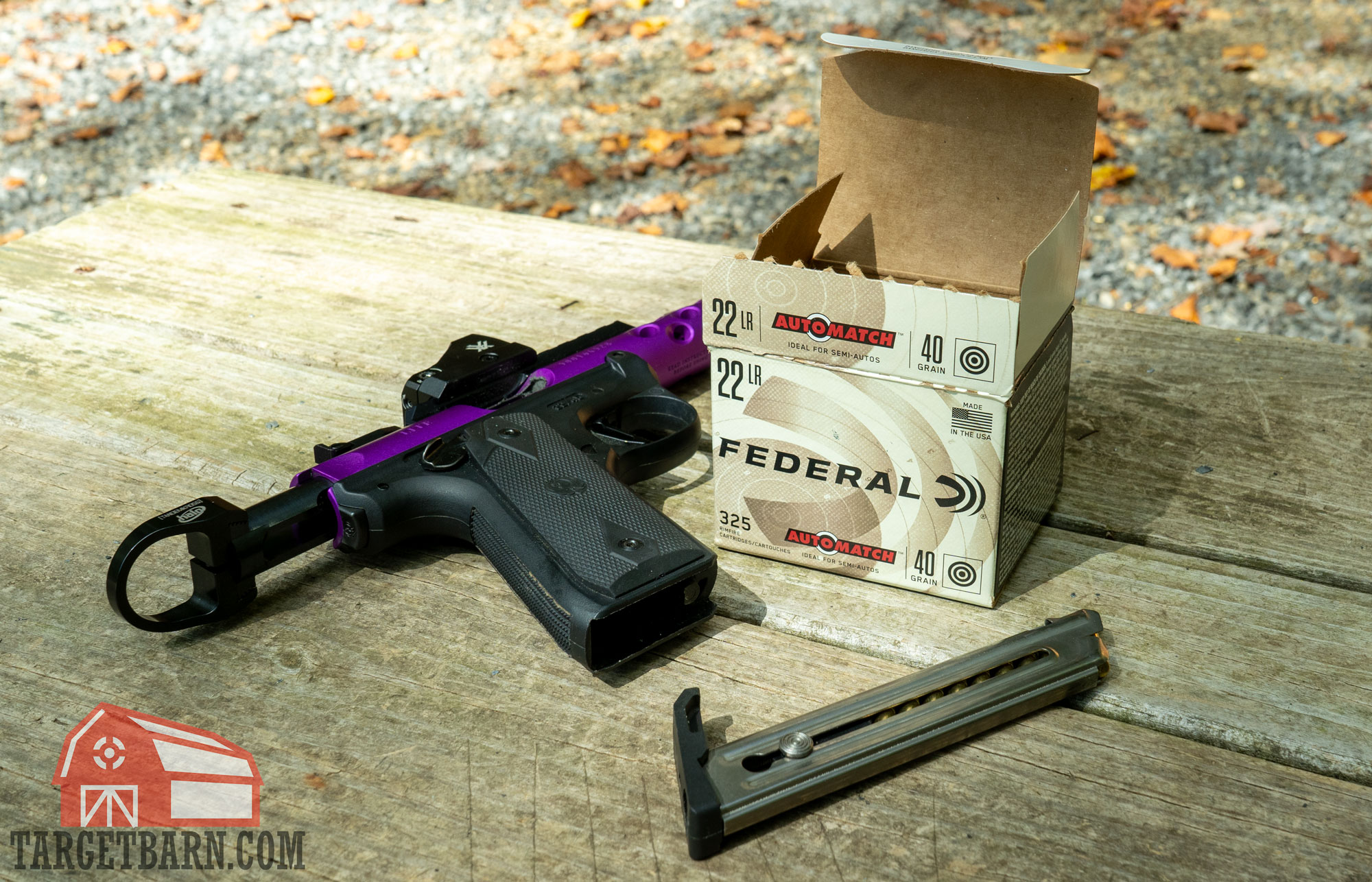 a ruger mark iv pistol, loaded magazine, and box of federal automatch .22lr at the range