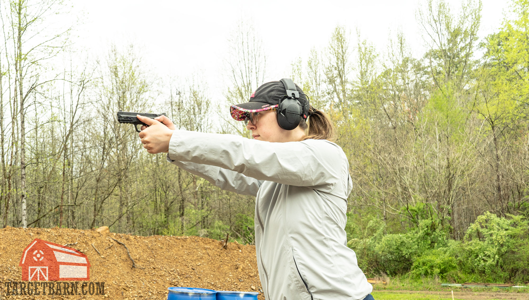 the author shooting a smith & wesson m&p shield ez 380 at the range