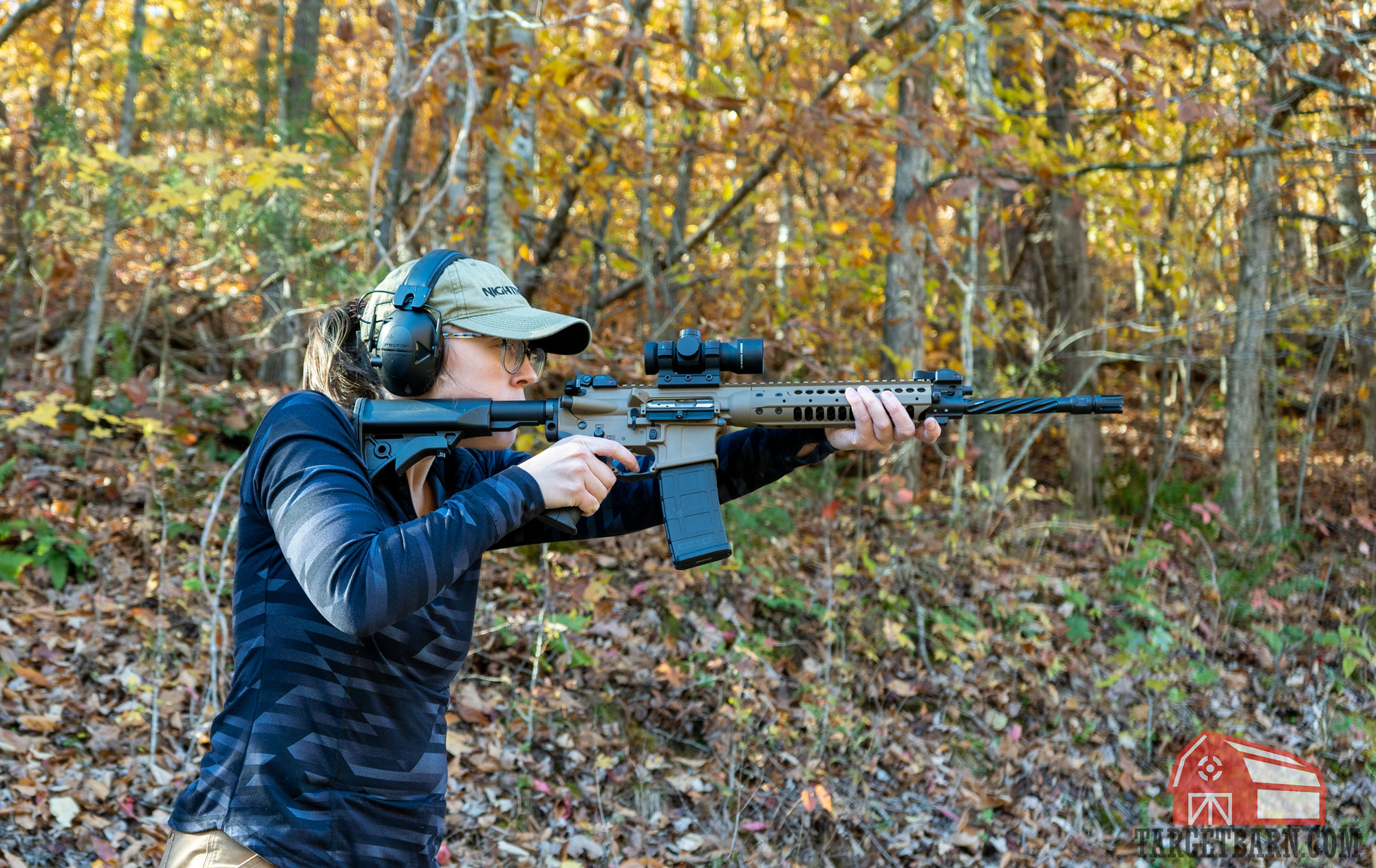 a woman shooting an ar15