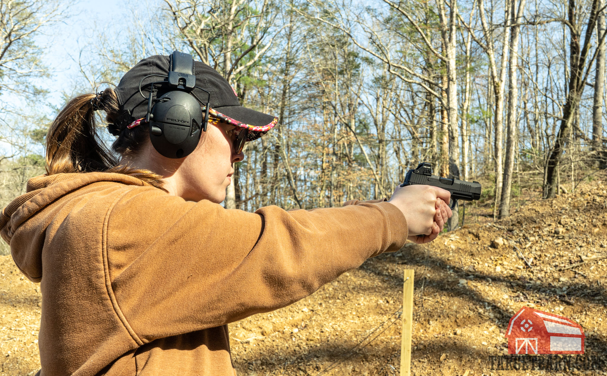 the author shooting blazer 9mm at the range out of a sig p365xl
