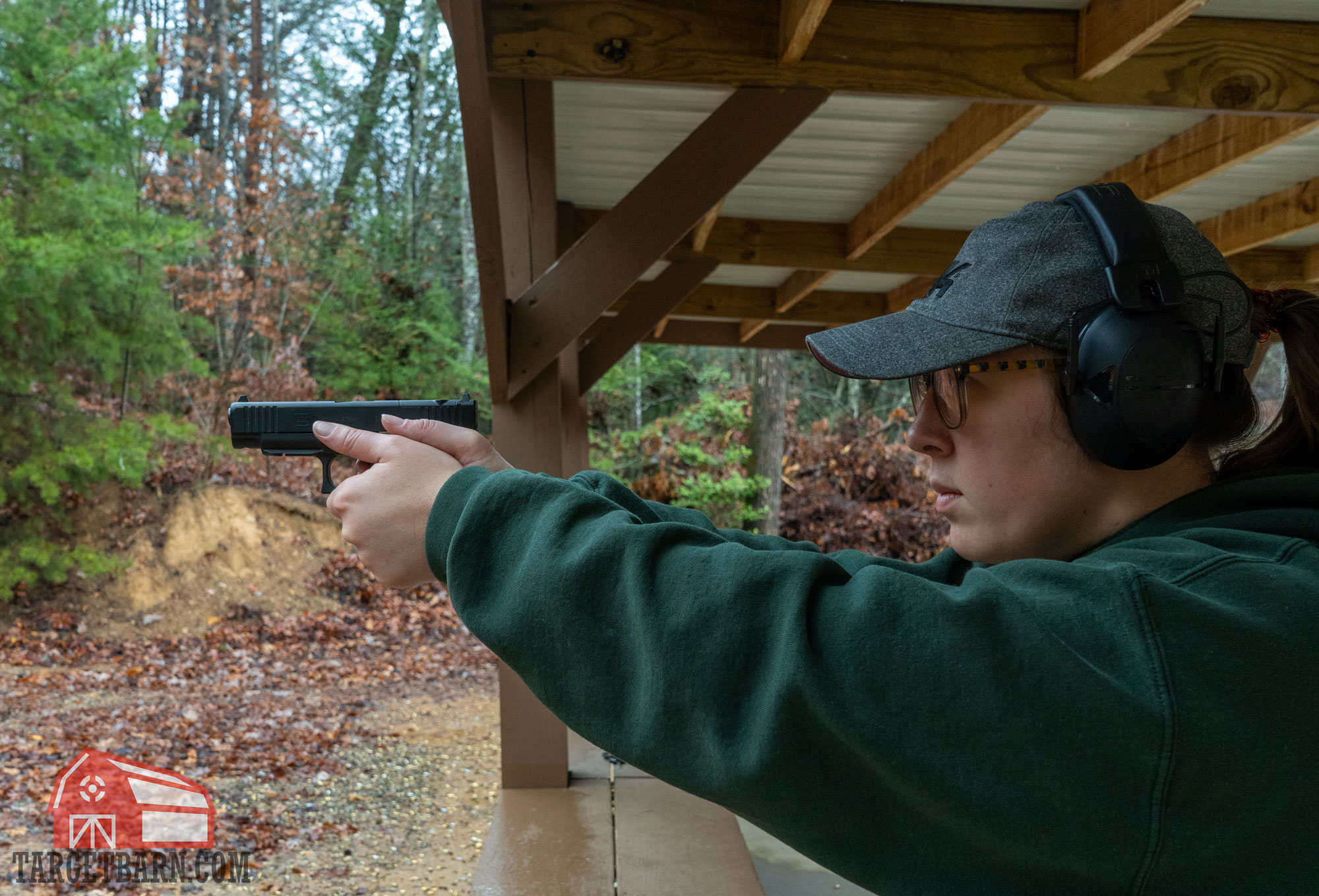 a woman shooting a glock pistol
