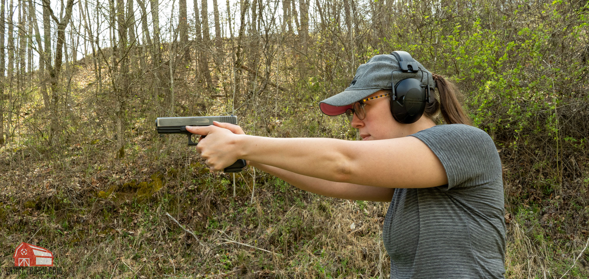a woman shooting a glock 21c 45acp