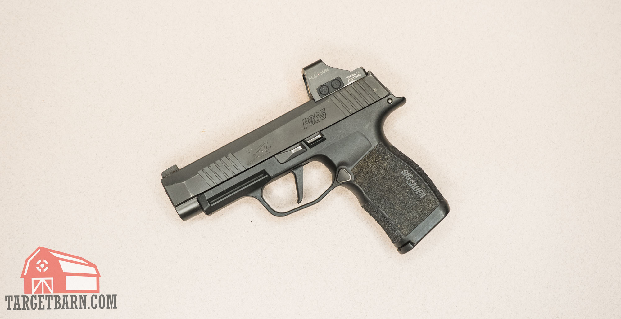 the sig sauer p365xl 9mm pistol with a holosun optic mounted on it