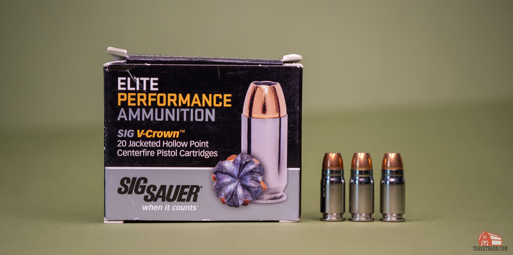 a box and three rounds of sig sauer elite performance v-crown ammunition