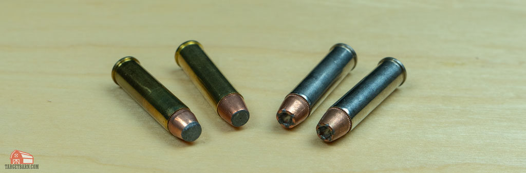 two soft point rounds next to two hollow point rounds