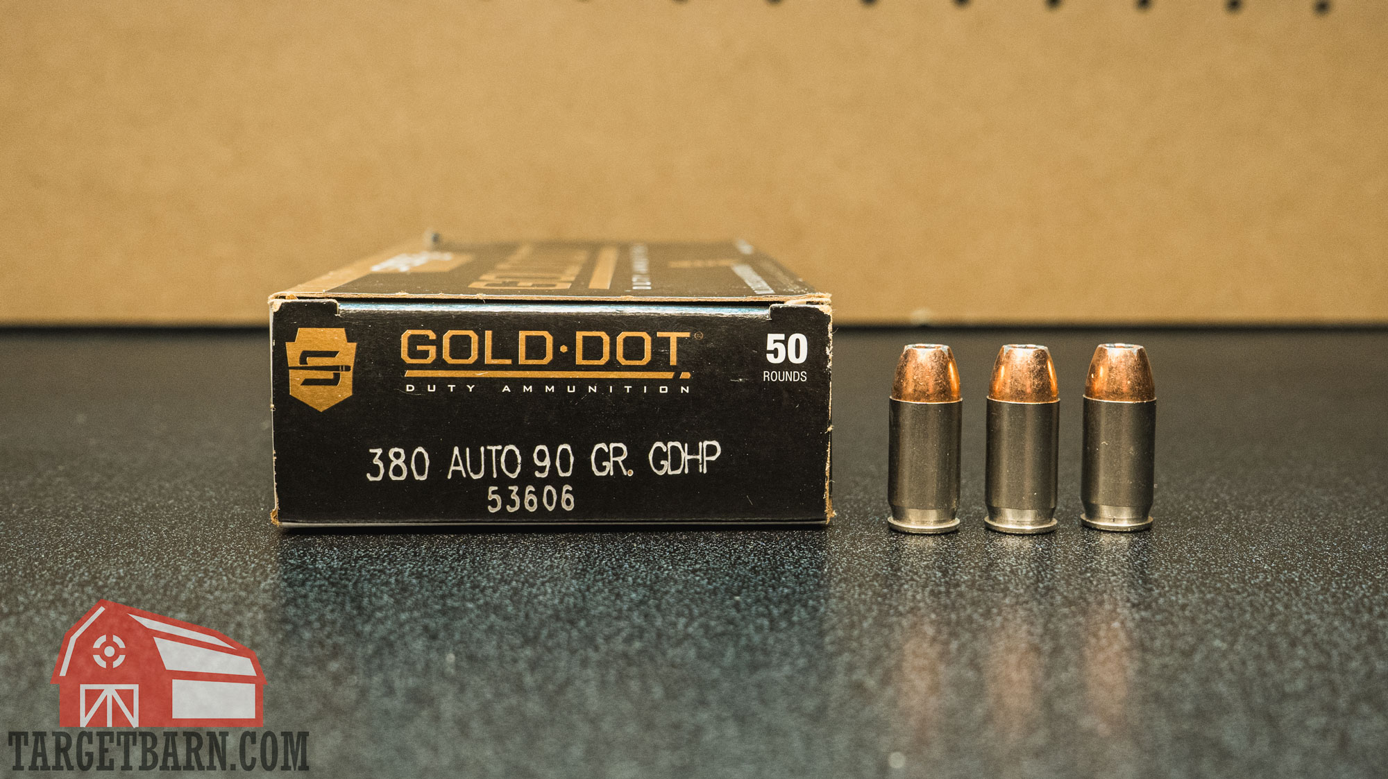 a box and three rounds of speer gold dot 380 ammo