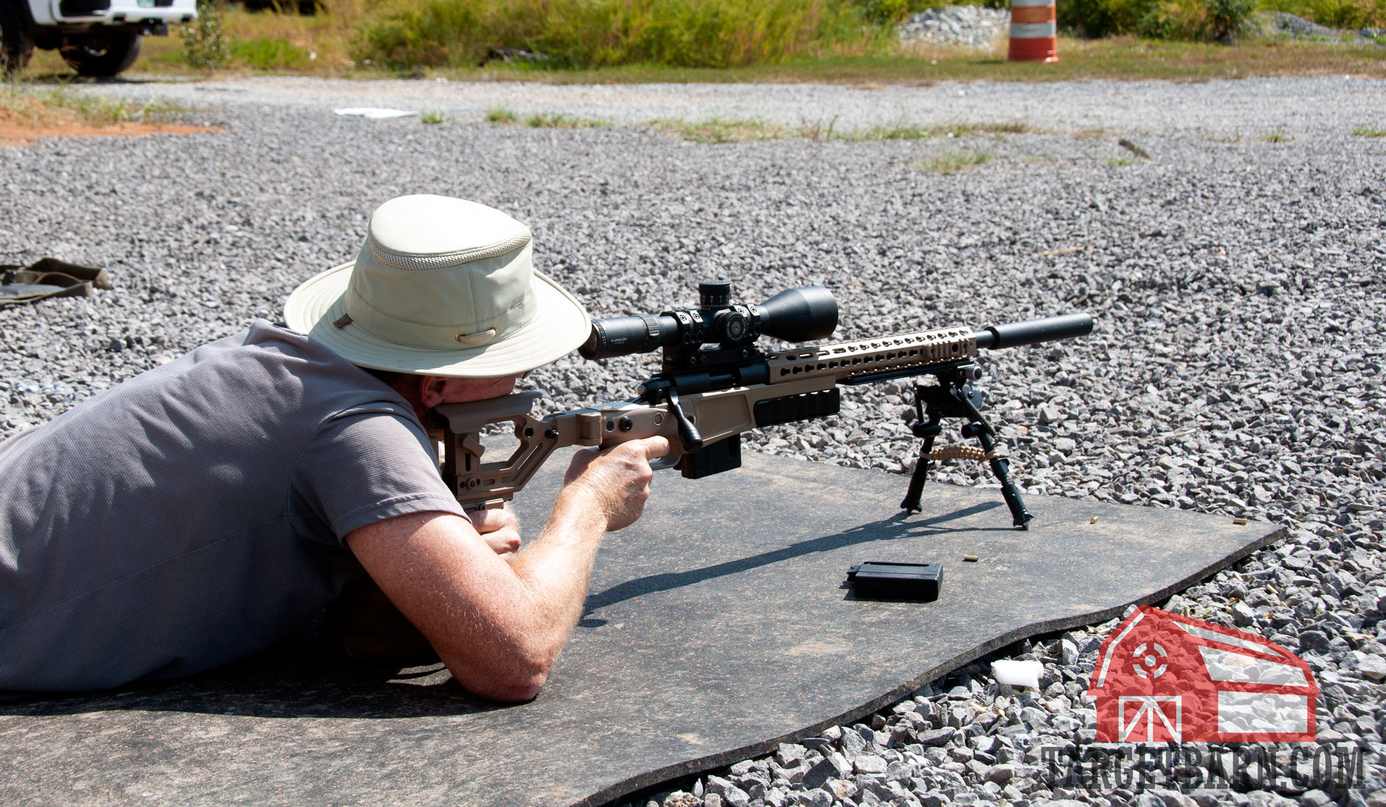 a man shooting a .22lr bolt gun with a suppressor using subsonic ammo