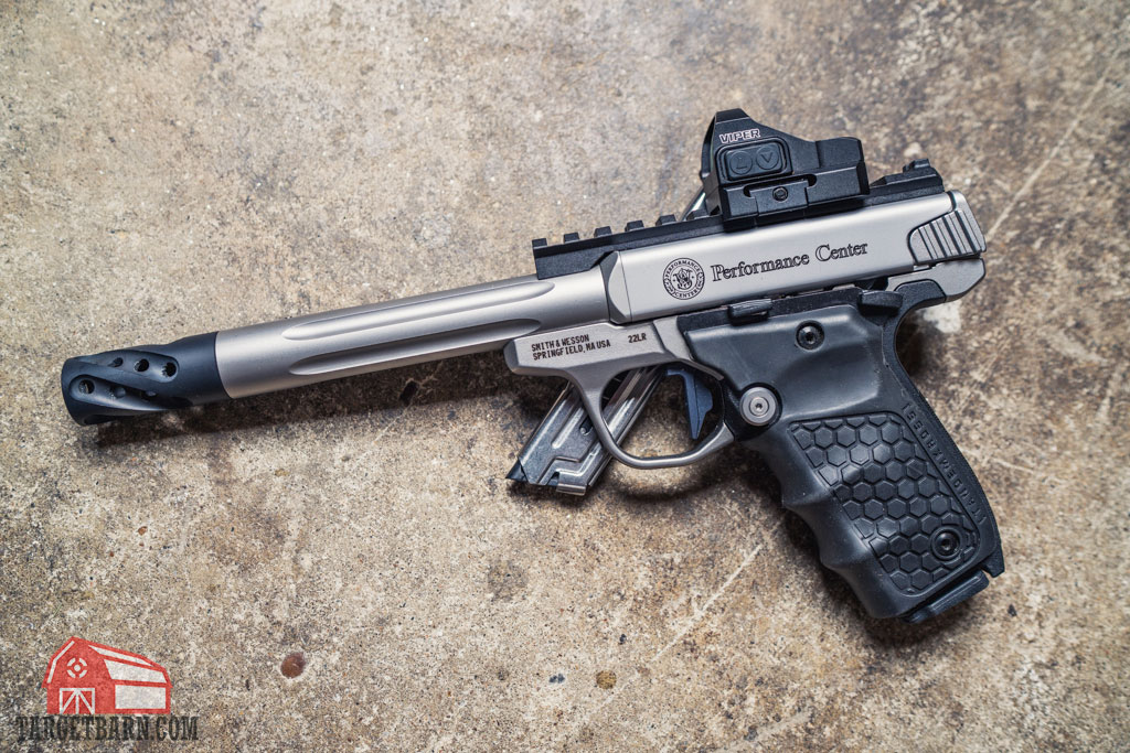 the smith & wesson sw22 victory propped up by a magazine