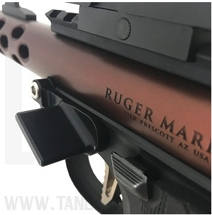 the striplin custom gunworks thumb rest mounted on a ruger mark iv 22/45 lite