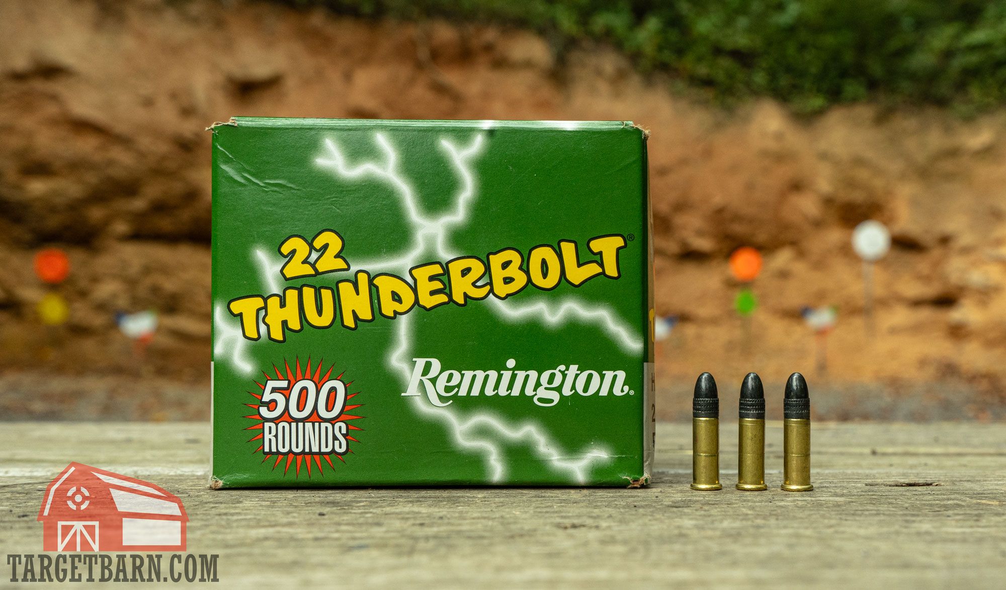 a box and three rounds of remington thunderbolt .22lr at the range