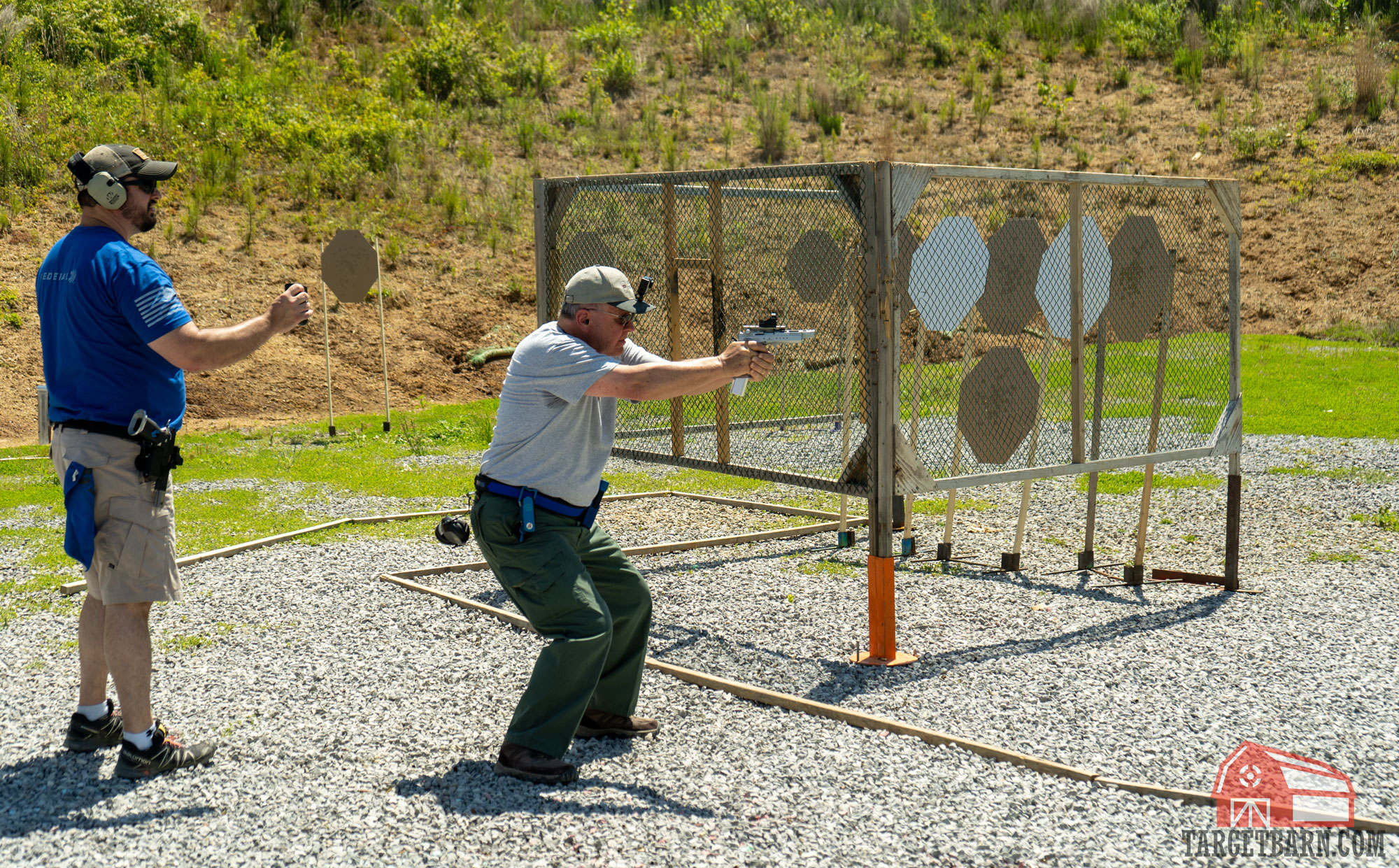 a man competing in a pistol shooting competition