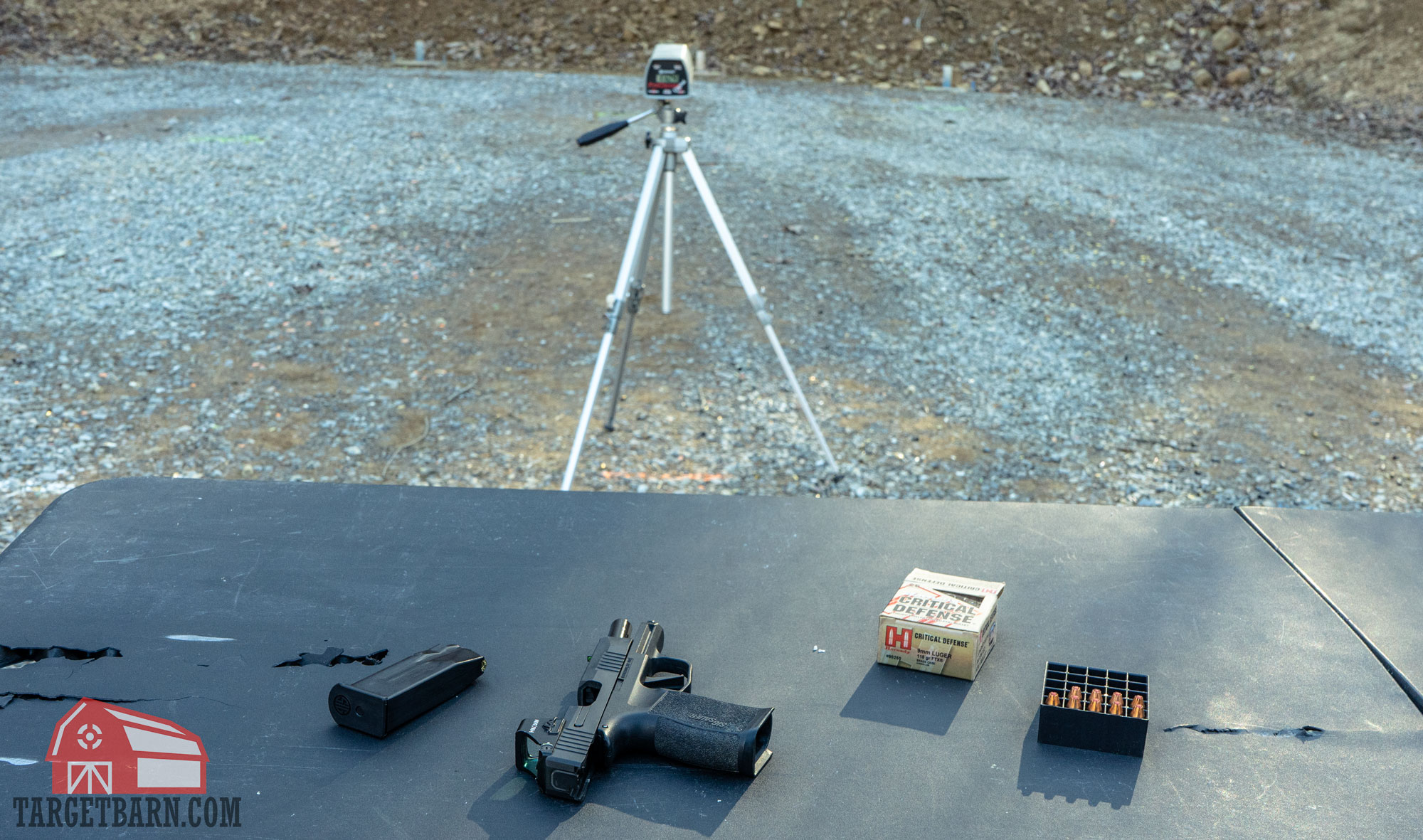 a chronograph and a gun and ammo set up for velocity testing